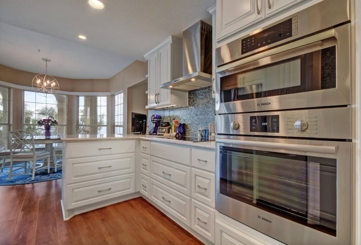 Photo #8 There is ample storage and counter space (quartz counters).  This is a chef