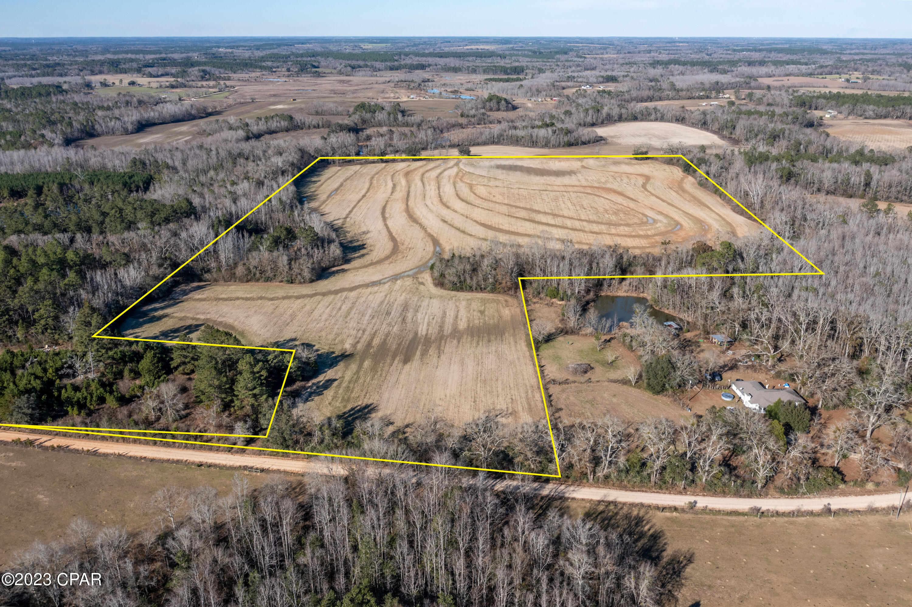 Beautiful high and dry cleared acreage 13 miles from center of Bonifay and only 0.5 miles down county maintained dirt road with 647 feet of frontage on CR-65. There is a pond on this property that you can fish from and plenty of deer and turkey if hunting or just watching them is your thing! Currently used as farm land but there is large trees all around the perimeter and this would be a beautiful place to build your dream home or even put a manufactured home on as there are no deed restrictions. Give your favorite realtor a call today and make it yours!