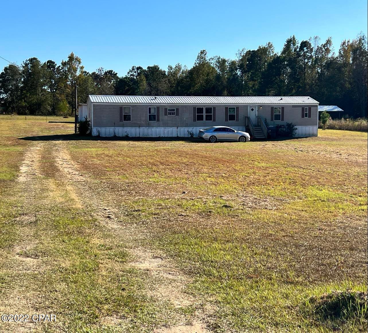 3 bedroom, 2 full bath 2003 Fleetwood single wide mobile home on 1.3 acres in Jacob City, Florida.  Septic installed 2021, city water.  Home was purchased from Fleetwood Homes in 2019 and Seller has lived there since then.  Jacob City is near I10 & Marianna.  Property's physical address is in Jacob City with address of Cottondale.  Marianna is approximately 20 minutes from home.   There are 2 outbuildings (sheds) behind mobile home measuring 1) 42x12 and 2) 33x12.