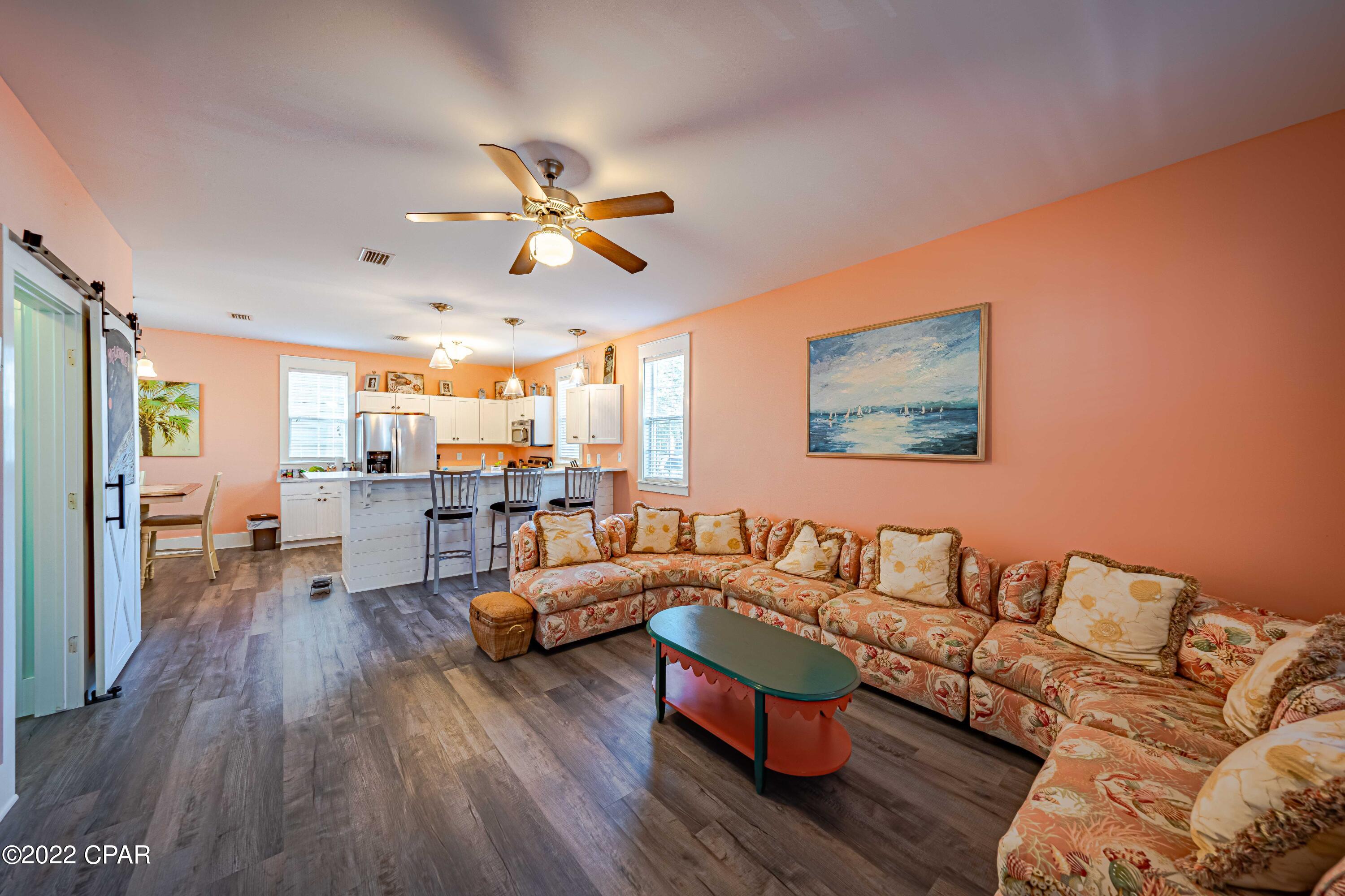 Imagine this:  your very own luxury cottage, in a small, quaint, beach town steeped with rich history, & natural beauty on the ''Forgotten Coast''? This grandiose beach retreat is 2 BR , 2.5 bath, with access to two pools, hot tub, playgrounds, grilling areas, community center with exercise equipment, grounds keeping and much more. Unit is complete with stainless appliances, hardwood floors & turn key ready! Each bedroom has an en suite private bath and the upstairs master has its own screened in porch/balcony. You'll also enjoy the screened in porch downstairs off the living area.  And, as if you don't think that's enough, your very own electric car charging station as well as solar panels for a more desirable electricity bill. You can't be beat if you believe in the beauty of salt life!