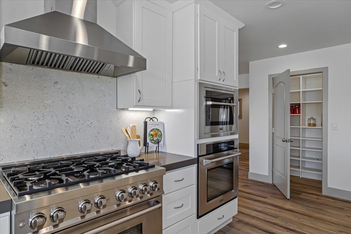 New walk-in pantry with custom closet organizers