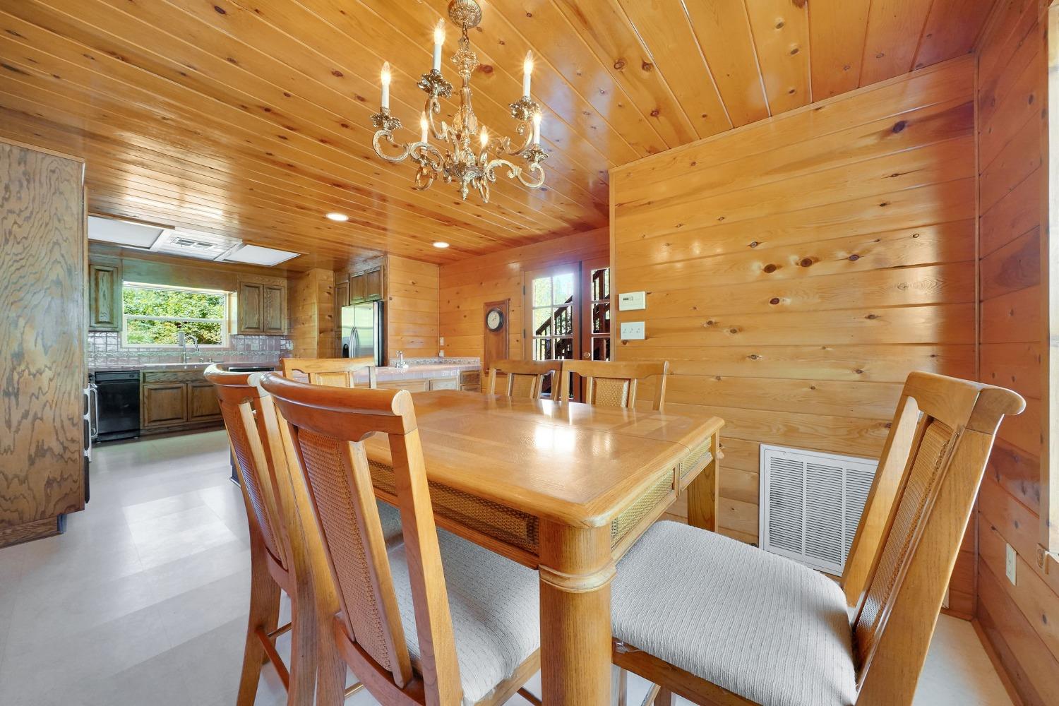 Breakfast nook off kitchen has a french door that leads outside