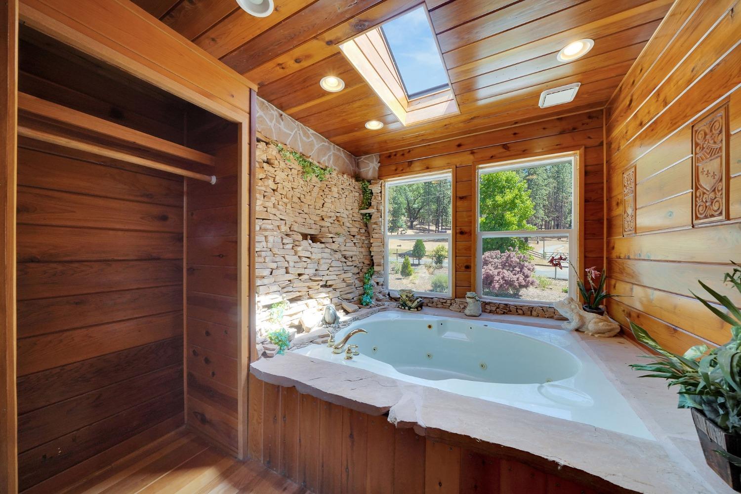 Jacuzzi room complete with working waterfall! off the primary bedroom