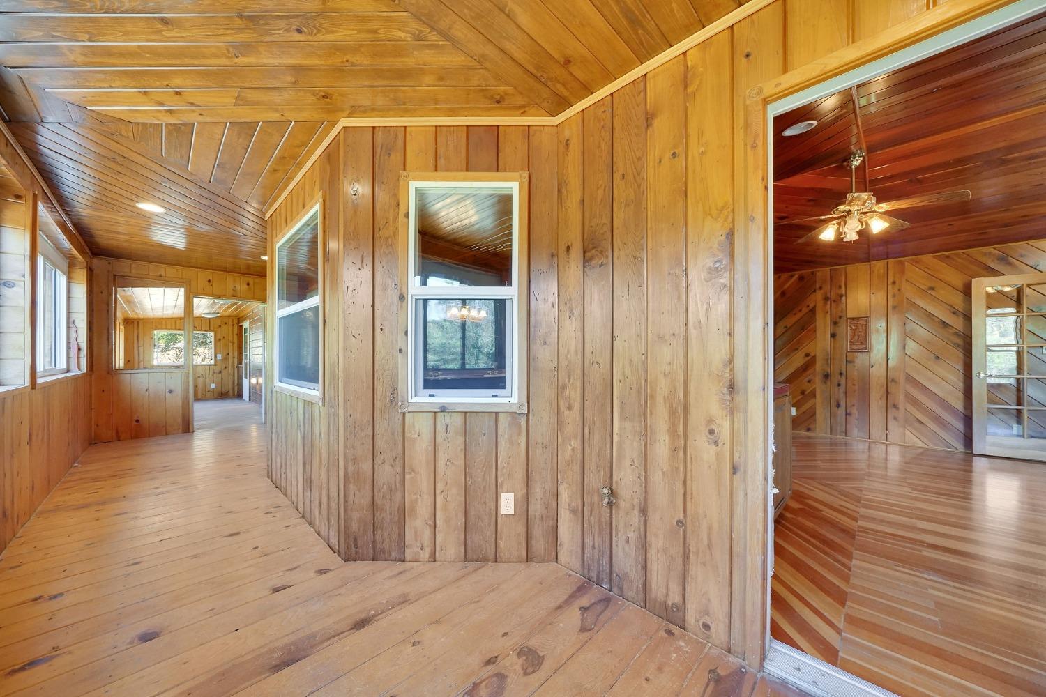 Covered enclosed deck off primary bedroom. It wraps around 2 sides of the house!