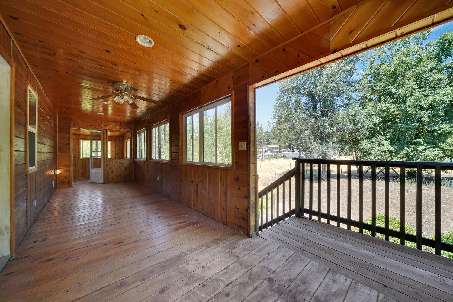 Stairs to the backyard off covered/enclosed deck