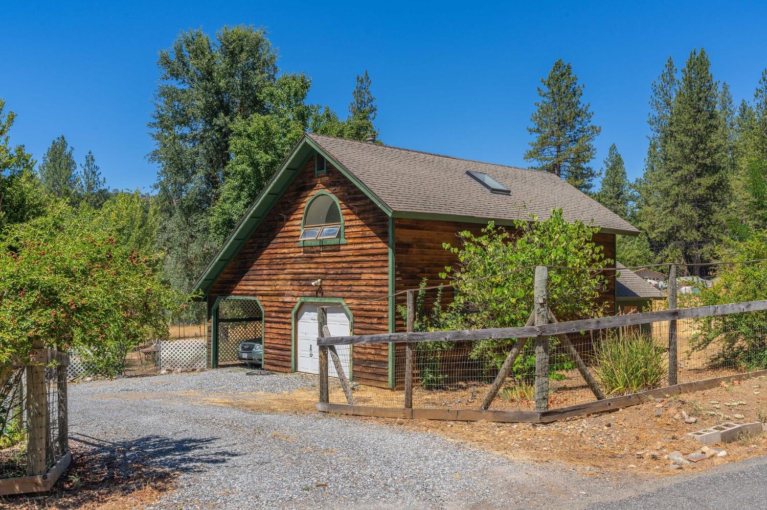 Detached garage has a large storage area above it that could be a guest room. There is a bathroom and laundry room downstairs that need to be remodeled and repaired.