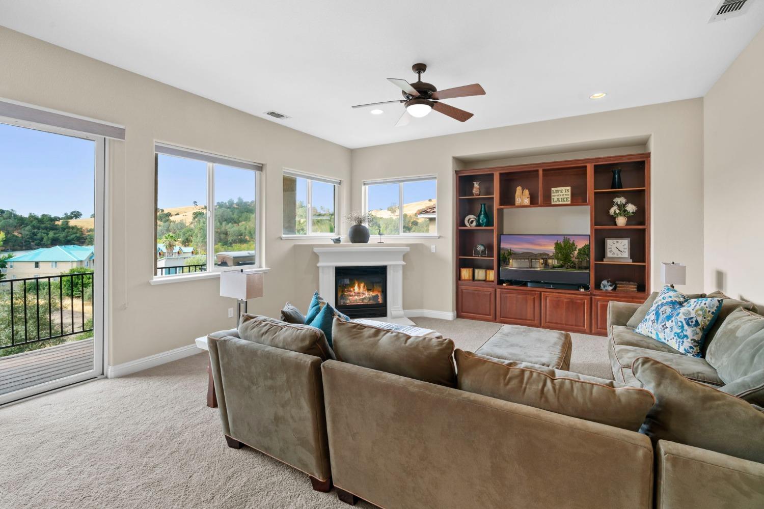 Built-in media center and cozy corner fireplace.