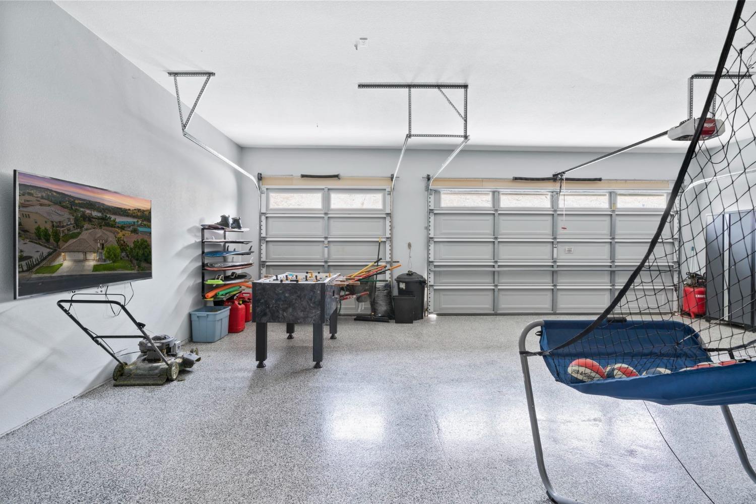 Large garage with epoxy flooring.