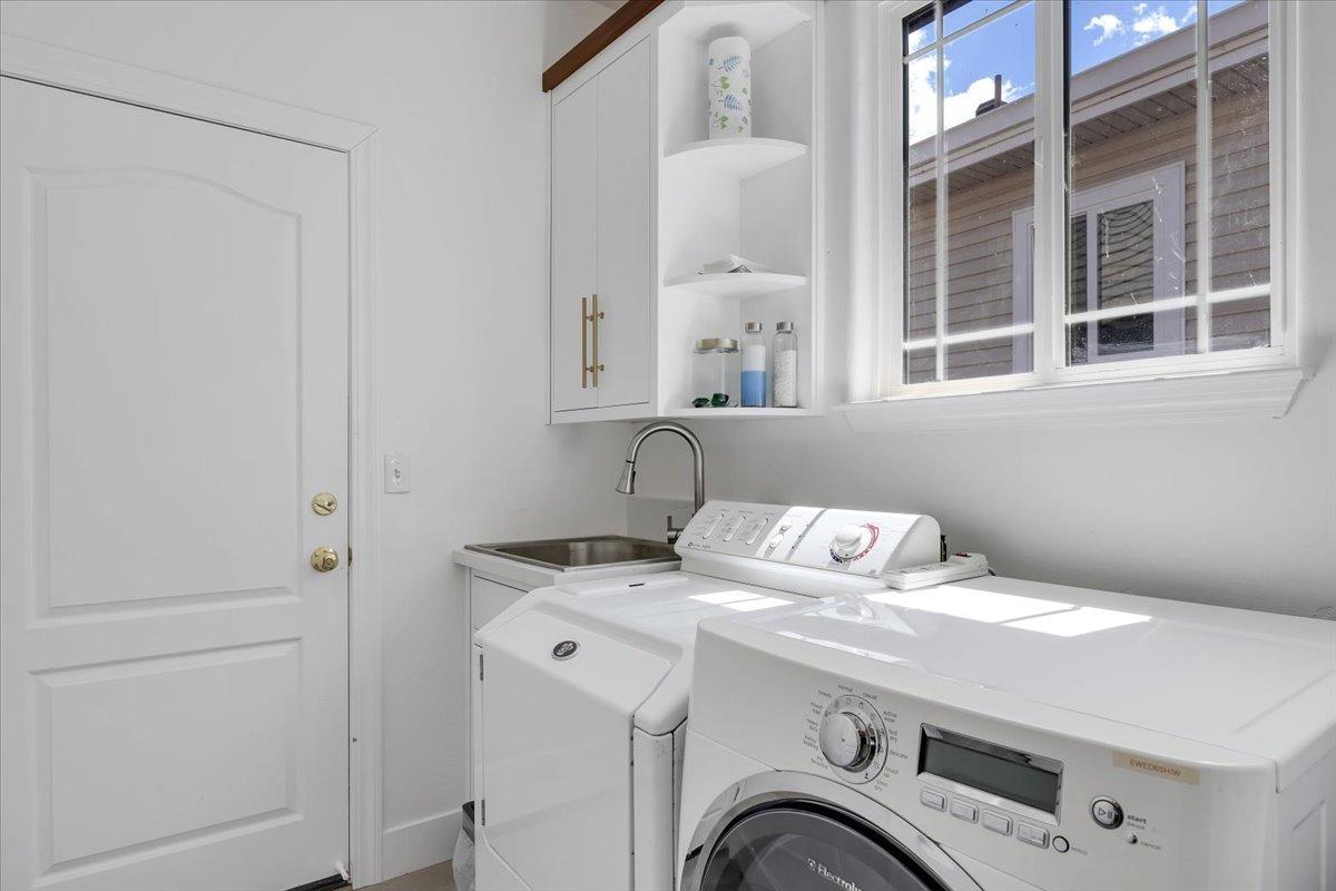 Bright laundry room leads to the over-sized garage.