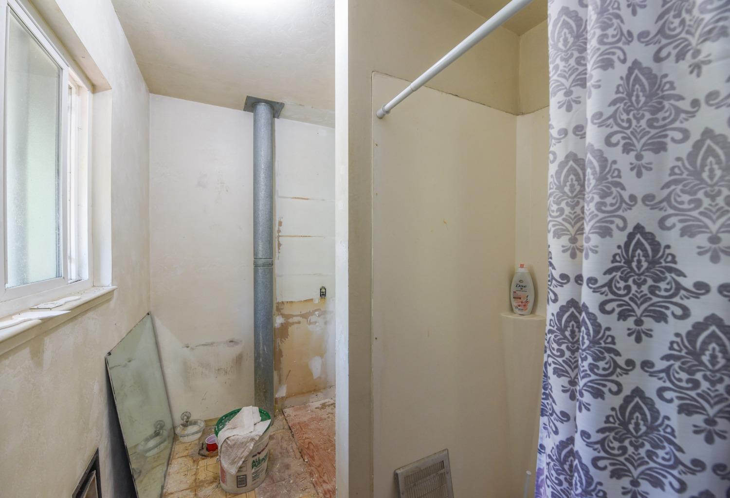 bathroom in bedroom one being remodeled