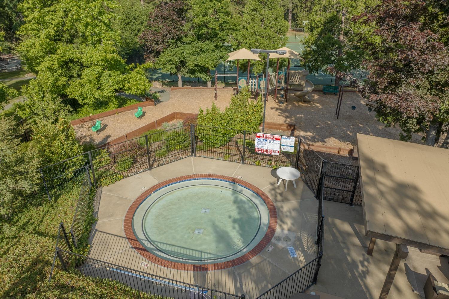 Hilltop playground, kiddie pool and cabana.