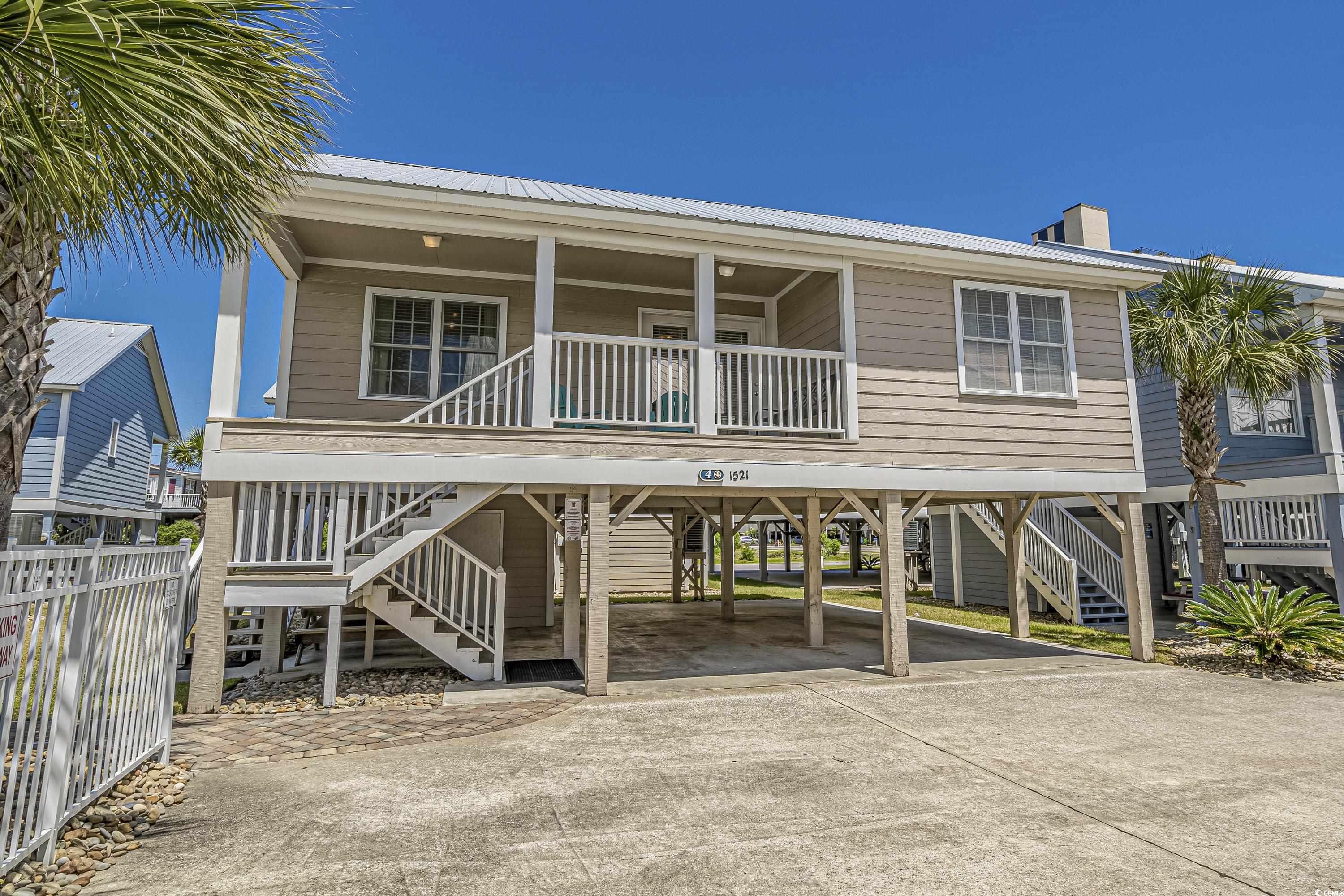 just across the street from the beach, summerwinds is a well manicured 2nd row complex of 16 raised beach homes.  these homes have been upgraded with hardi-plank exteriors, all new windows, doors, railings on the porch, decking and steps.  the entire complex had new drainage, landscaping with river rock, saga palms and flowers along with pool upgrades.  cottage #4 is a 4br/2ba offered furnished with a private lockout owners room ( 4th bedroom w large closet has 2 beds ) that adds additional sleeping quarters, accessed by a staircase next to the full size washer/dryer closet. this beach cottage has much to offer. under the home, there is plenty of parking, an attached 14 x 12 ft. storage room perfect for a refrigerator, shelving and lots of space for beach gear, a large picnic table and outdoor shower w/ a water spigot.  the large covered front porch looks over the pool, and has lots of room for multiple rockers or your favorite chair.  inside, the tasteful beach décor helps promote the feeling of peace and fun with the cool coastal colors and textures.  spacious bedrooms with ceiling fans, tiled shower areas in bathrooms, large galley kitchen and full size washer & dryer inside will help give you and your guests the vacation get-a-way deserved.  the hoa fee covers insurance, pest control, basic cable, water/sewer, trash, lawn/pool maintenance.  summerwinds  cottage #4 is a must see, make your appt today.