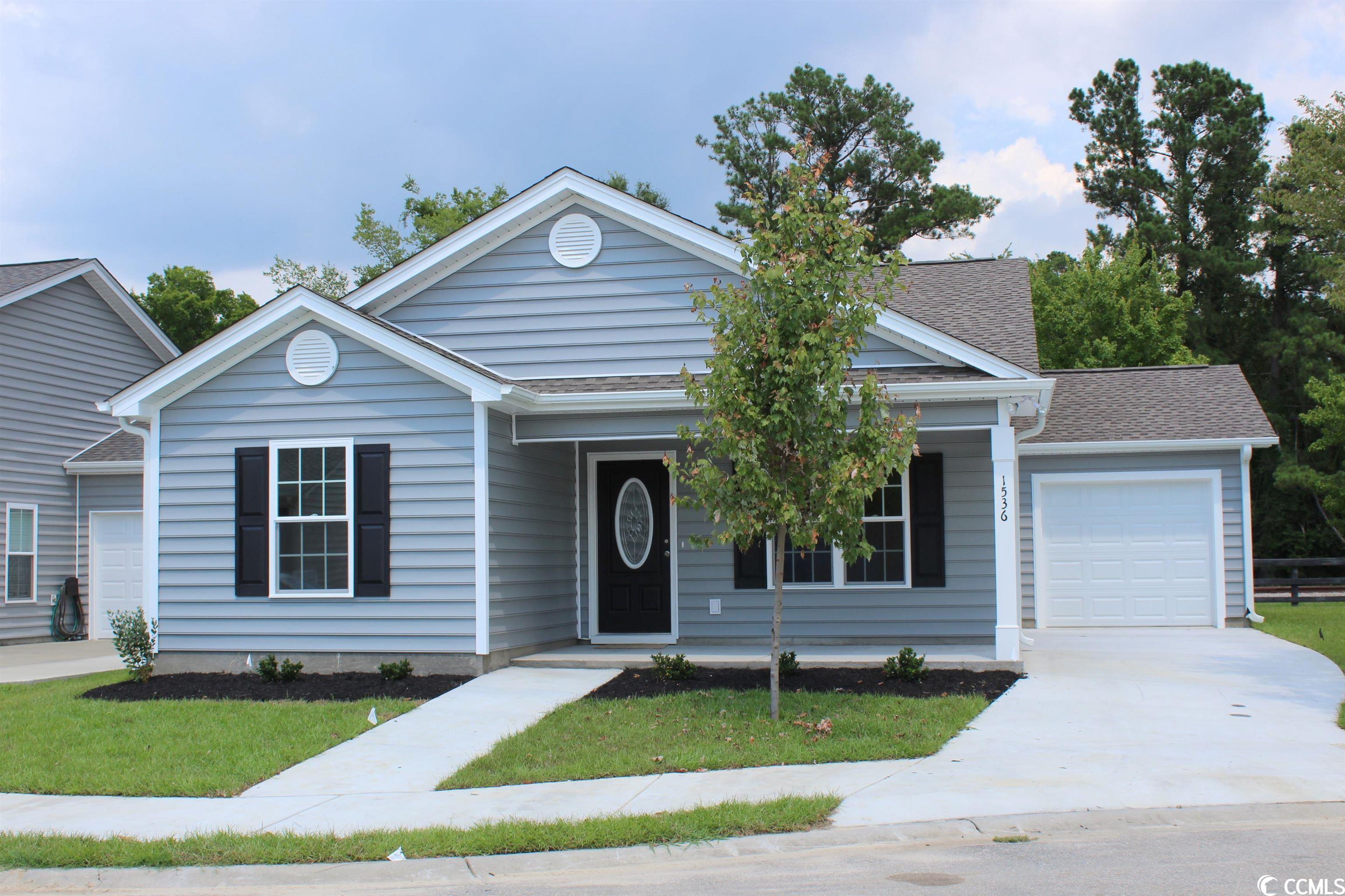 briarfield is a small community of single family homes located off of hallie martin road in conway. a convenient location with easy access to hwy 501, not far from restaurants, shopping, and all that conway has to offer. the carolyn floor plan has a welcoming low country covered front porch and a covered rear porch with patio. the living room has a vaulted ceiling with ceiling fan. the kitchen has stainless steel appliances, solid wood cabinets with crown molding, a breakfast counter open to the dining area with glass sliders to the rear porch and a large pantry closet. private master bedroom suite has a tray ceiling, 2 walk-in closets, a garden tub plus a separate walk-in shower and a raised height double sink vanity. single car garage completely finished with automatic door opener. laundry room, window and door casings, 5 ¼” baseboards. sod and irrigation, gutters on the front of the house, and 30 year roof shingles. photos are for illustrative purposes only and may be of similar house built elsewhere. square footage is approximate and not guaranteed. buyer is responsible for verification.
