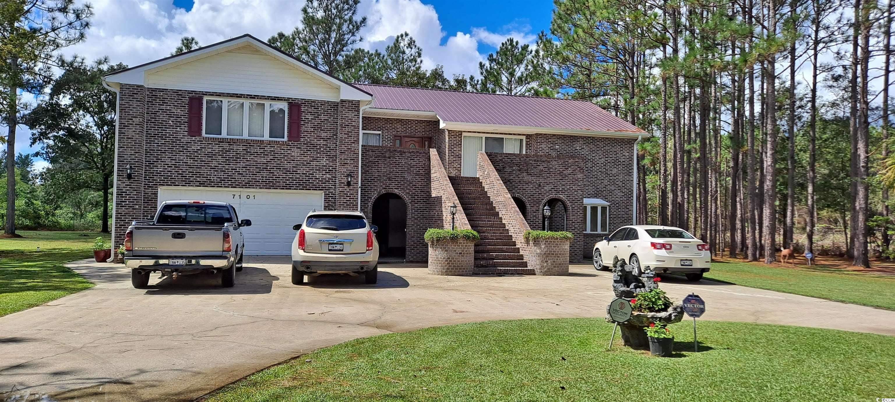 there is tons of space in this lovely home! it has a spacious living room with a fireplace and windows that you can see the treetops through. an eat-in kitchen area that leads to a balcony from which you can see the pond. it has a formal dining room for large get-togethers, an office area, and a roomy owner's suite with its adjacent bathroom. there are three additional bedrooms, a den with its fireplace and a small bar area and an adjoining game room. outside there is a pond that i am told is stocked with fish. this home is about ten minutes from downtown georgetown with its restaurants, boardwalk and east bay park with tennis courts, a one-mile walking path and boat landing. it is about 25 minutes from pawleys island beach and go about another five minutes to be at the beautiful huntington state park and beach. there is also a very nice bike trail in pawleys island. you would be approximately an hour from myrtle beach and approximately an hour and fifteen minutes from charleston. there's a plethora of things to go and do, or just stay and enjoy this lovely home. square footage is approximate and not guaranteed. buyers responsible for verification.