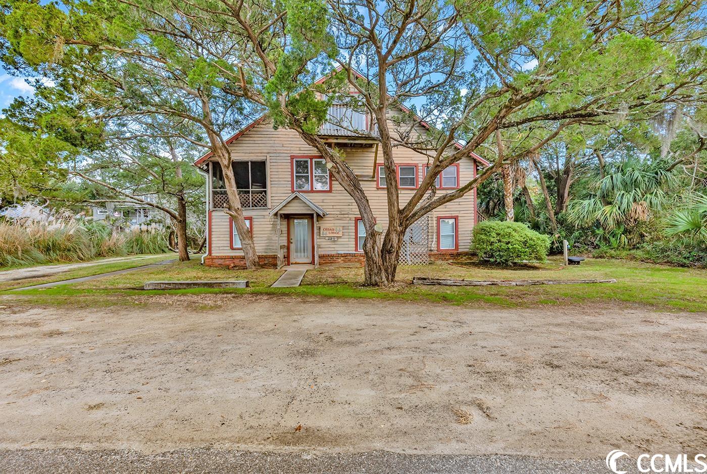 a unique offering! cedar lodge represents old pawleys island, the way it used to be! included with the sale is the creek lot across the street. the building is being sold "as is" with no representation as to the condition.  opportunities abound, one could renovate and update or tear down and start over!  as the photos show the unobstructed views are stunning of the creek and sunsets! ease through a maritime forest to the convenient beach access. there is a permanent driveway easement to the north of the house. the east side of atlantic is .11 acres and the west side is 1.48 acres.