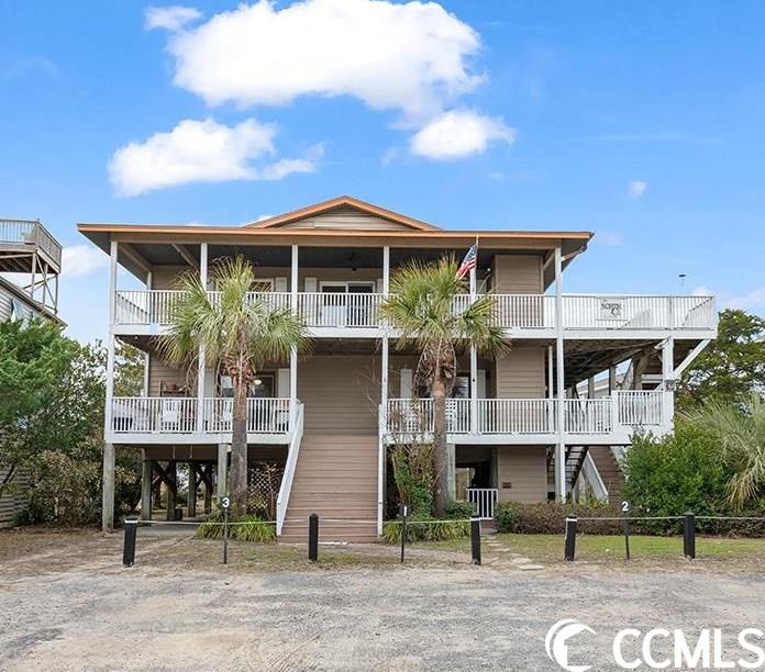 this is a unique pawleys island offering! great location steps to the beach via pierce street beach access!  currently set up as three apartments, top floor consists of a 3 bedroom/2 bath apartment with access from a private elevator and stairs, and the first floor has two 2 bedroom/1 bath apartments. this property could easily be converted into one large residence or continue as a permanent residence on the top floor with weekly or monthly rental income from the 2 apartments on a very large lot! wonderful porches and decks with peeps of the atlantic and creek sunsets! top floor apartment is being sold furnished (with a list of exceptions) and has hardwood floors, large kitchen, family and dining room combination, primary bedroom with private bath, two additional bedrooms and a large carolina room overlooking the back yard. room for a pool, space for entertaining and is the perfect place to enjoy the famed pawleys island 4th of july parade! the two first floor apartments are being sold unfurnished. plenty of parking and underneath the home is open and perfect for entertaining!  ask your real estate agent for the impressive rental projection numbers. all measurements are estimates and should be verified by prospective buyers if needed.