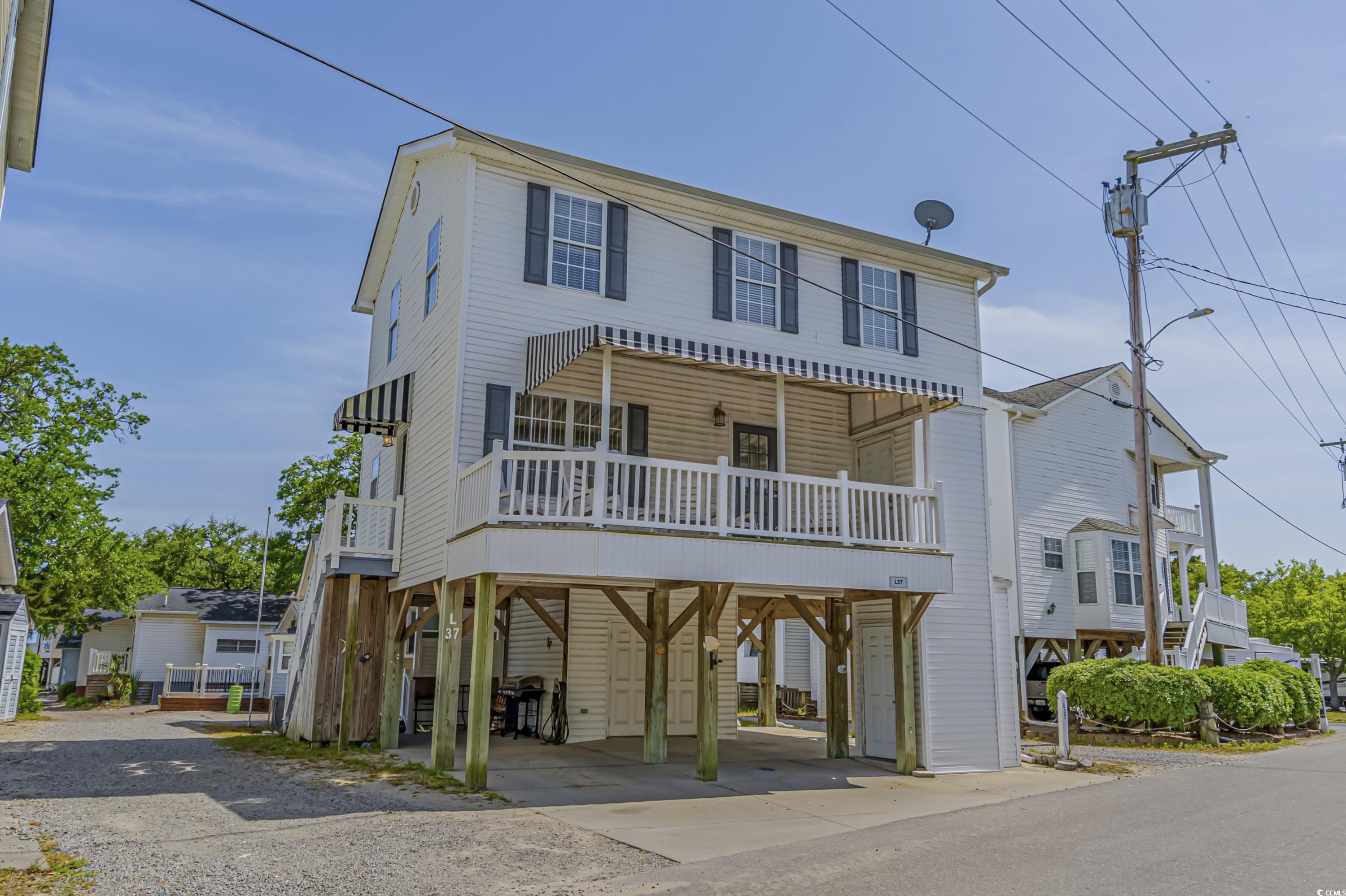 great rental property located in ocean lakes.  this 2 story raised beach house offer 4 bedroom and 3 baths.  master bedroom and large full bath on main floor and 3 additional bedroom, 2 full baths, and a large den/living area on the 2nd floor.  house has elevator, super clean, close to all amenities and ocean.  ask agent about 2021 and 2022 gri