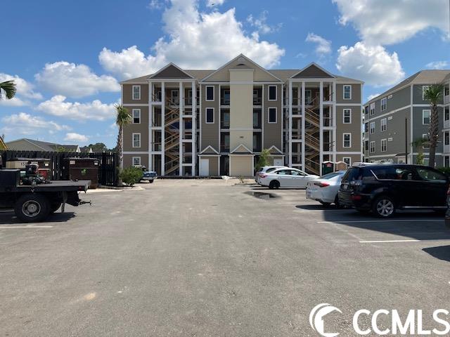 located in one of the most successful condo developments in the myrtle beach area, this third floor corner unit is a 3-bedroom 2-bathroom bright and airy condo in the very popular queens harbor! the unit offers a split bedroom floor plan with a double-door entry to the master suite from the family room, boxed tray ceilings in the living room and owner's suite, a screen porch and an outside storage closing. the amenity package includes elevators in all buildings, a resort style swimming pool with club house and conveniently located picnic areas with grills. the location is superb with shopping, dining and recreation steps away.