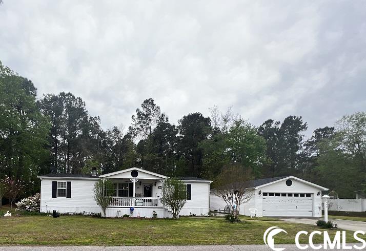 what a fantastic opportunity to own a home near all myrtle beach has to offer. this double wide manufactured home is located on leased land in conway plantation. the home features 3 bedrooms, 2 full bathrooms, a gas burning fireplace and a split floorplan. there is an inviting covered porch on the front of the home that is perfect for rocking chairs and morning coffee. off the back of the home is another covered porch that over looks a wooded area. an added bonus to this home is the large detached garage with a built in work bench. there is a community swimming pool and a playground in the development. call your agent today for more details and to schedule a showing!