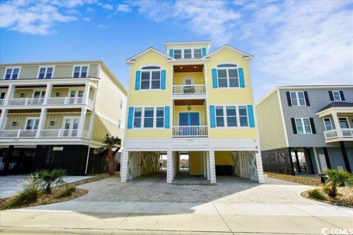 "life is good" is exactly what it says. it is an investors dream with one of the highest rental incomes on the entire grand strand and has been meticulously maintained. it was built in 2019 and sets directly on the ocean offering 8 bedrooms and 8 and a half baths. four of the bedrooms are master suites on the ocean and all the bedrooms have their own baths making it convenient and private.      the home is raised with parking for 9 cars and two golf carts and features an onsite level 2 enel x electrical vehicle charger. the large, heated pool and spa are on the oceanside with plenty of lounge chairs and features a gas grill, outdoor dining, an outdoor living area with tv, and an enclosed shower and foot wash.       an elevator runs from the parking area to all three floors above so guests do not have to carry heavy luggage or groceries upstairs.  the first floor features a massive kitchen with plenty of cabinets, granite countertops, stainless steel appliances including two refrigerators and a convection oven along with a gas stove.  the dining area is capable of accommodating 32 people and it, along with the large living area, have a panoramic ocean view.  completing the first floor are a bedroom featuring two queen beds, and large washroom with two sets of washers and dryers and wash sink.  doors take you from the living and dining areas to a large 2nd-floor porch overlooking the ocean with plenty of rockers to enjoy the ocean views.      on the second floor are five bedrooms including four double-queens and three kings.  two of the kings lead to a third floor porch overlooking the ocean with rockers to enjoy the sunrise. the third floor features a large media area, play room with pool table, wet bar and refrigerator, and two additional double-queen bedrooms.       one can search and search and not find anything like this on the grand strand.  it is close to area restaurants, golf courses, shopping, and world class entertainment. put this one on your list to see. you need to visit to appreciate all it has to offer!