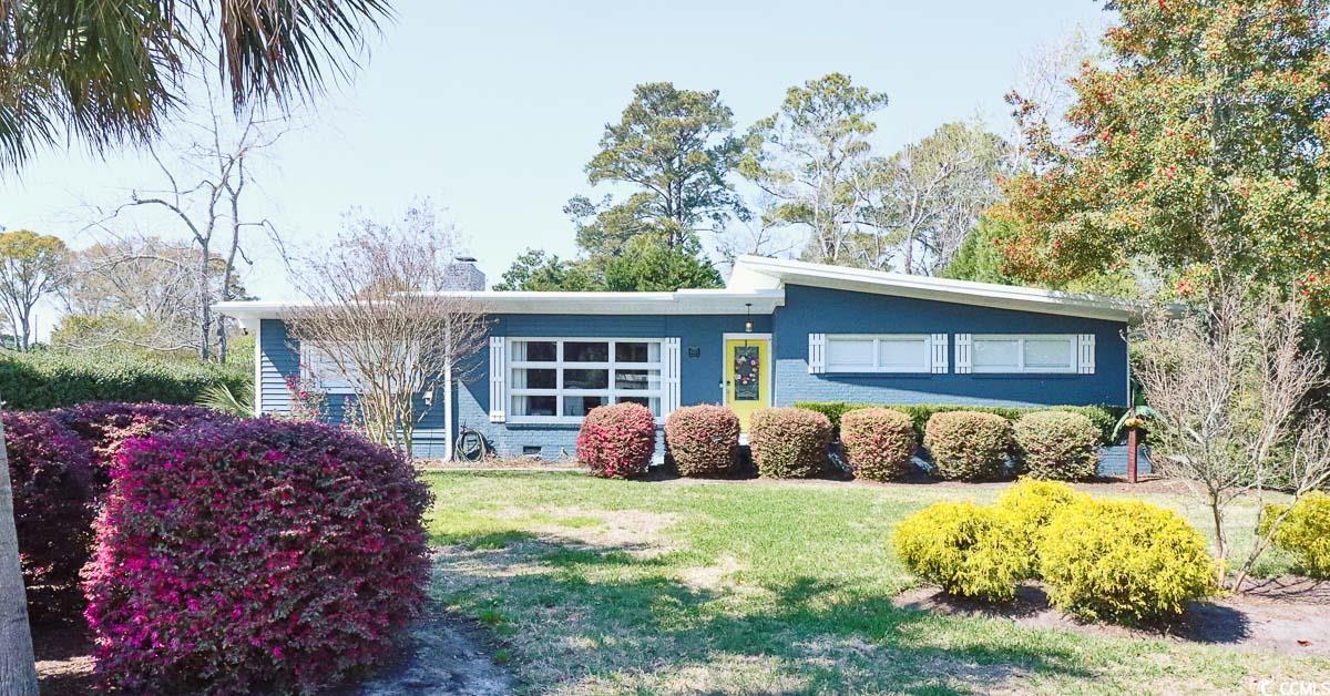 welcome to 6303 colonial dr, a stunning 4 bedroom, 3.5 bathroom home located just a short drive away from the beach in beautiful myrtle beach. this property offers the ultimate in comfort and convenience, with no hoa fees to worry about. the spacious living room boasts a service window from the kitchen, a cozy fireplace for those relaxing nights, and an abundance of natural light that fills the room. the kitchen is a chef's dream, complete with attractive stainless steel appliances that include a built-in double oven, an oversized island with a breakfast bar, beautiful quartz countertops, and stylish wood cabinets that provide ample storage space. the master suite is a true oasis, with an enormous walk-in closet and a large sitting area that is bathed in natural light. the master bathroom features a spacious walk-in multijet shower, a roomy tub, and a quartz countertop double sink vanity with great storage underneath. one of the other bedrooms also has its own private bathroom, providing an additional level of privacy and comfort. this incredible home also boasts a formal dining room with a fireplace, and bonus space off the living room that can be used as a playroom, office, or whatever fits your needs. outside, you will find an oversized deck and a backyard surrounded by beautiful nature, providing a peaceful and serene space for relaxing or entertaining guests. located near 62nd ave in myrtle beach, this property offers easy access to all the attractions that this area has to offer, including the beach, the intracoastal waterway, broadway at the beach, coastal grand mall, market commons, myrtle beach state park, the myrtle beach boardwalk, lots of golf and mini-golf options, more shopping, incredible restaurants, and endless entertainment. don't miss out on the opportunity to make this amazing property your new home. schedule a tour today!
