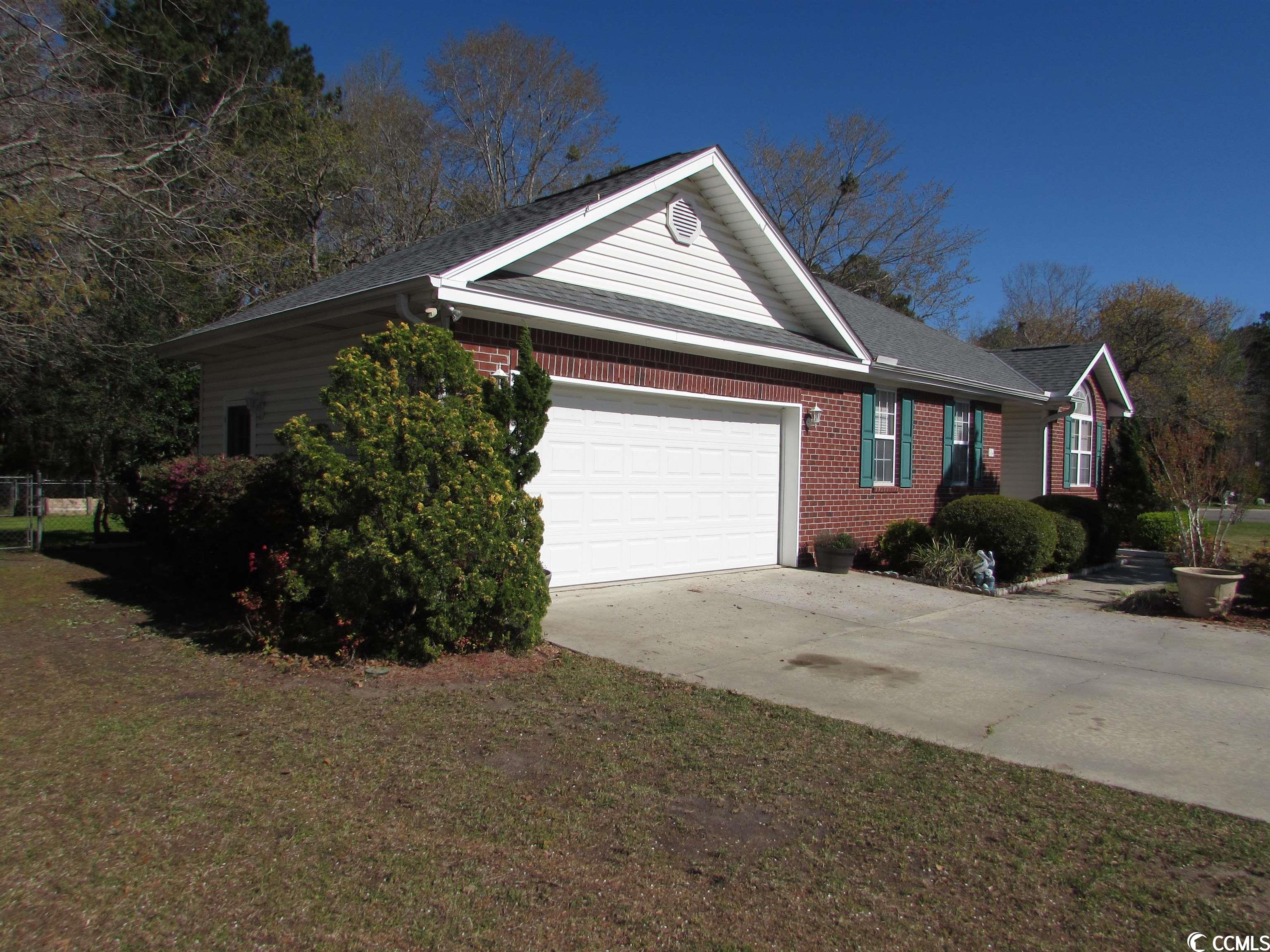book your showing today to see your now way under value priced home that is currently by far the lowest priced home in the whole mls with a garage, fencing, screen porch and no hoa!! this three bedroom, two bath ranch style home also sits on an almost half acre of land and has a fully fenced in private backyard. they have done many updates since purchasing the home. from all new appliances, solid surface countertops, roof, air handler, paint, screen porch, covered patio, wood patio extension, storm doors, gutters with leaf filter coverings that have a transferable warranty. the kitchen has 42" cabinets, solid surface countertop, backsplash, pantries, breakfast bar and a built-in spice rack. all kitchen appliances and the washer and dryer convey. the flex room off the kitchen could be used for so many things from office, den, game room, study area, etc. the master bedroom, front bedroom and the living room have vaulted ceilings for that bigger feeling. get your green thumb going with your own raised garden beds for anything you want to grow and two additional outside storage buildings for all your lawn and garden needs and equipment. home has two water meters. one for the home and one for outside garden and watering. the home also sits on an extra high raised slab foundation that helps to keep it above the elements. the roof was replaced in 2020. the screen porch has vinyl panels that slide up and down to let the southern breeze flow through at different levels or keep the weather out. allows it to be more of an all-season porch. has additional under roof patio area off the screen porch and the kitchen for extra entertaining space. the two-car garage has new raised storage shelving to give extra space for your belongings and more. the garage also has a side entrance door to give easy access while working outside in the yard. conveniently located and not far from everything the grand strand has to offer from shopping, hospitals, colleges, restaurants, golf, highways, airport and so much more. all the beaches with its activities one way and historic downtown conway the other way and its river town vibe. the castlewood community is also in the carolina high school district. schedule your showing today to put your own personal touch on your home of tomorrow!!