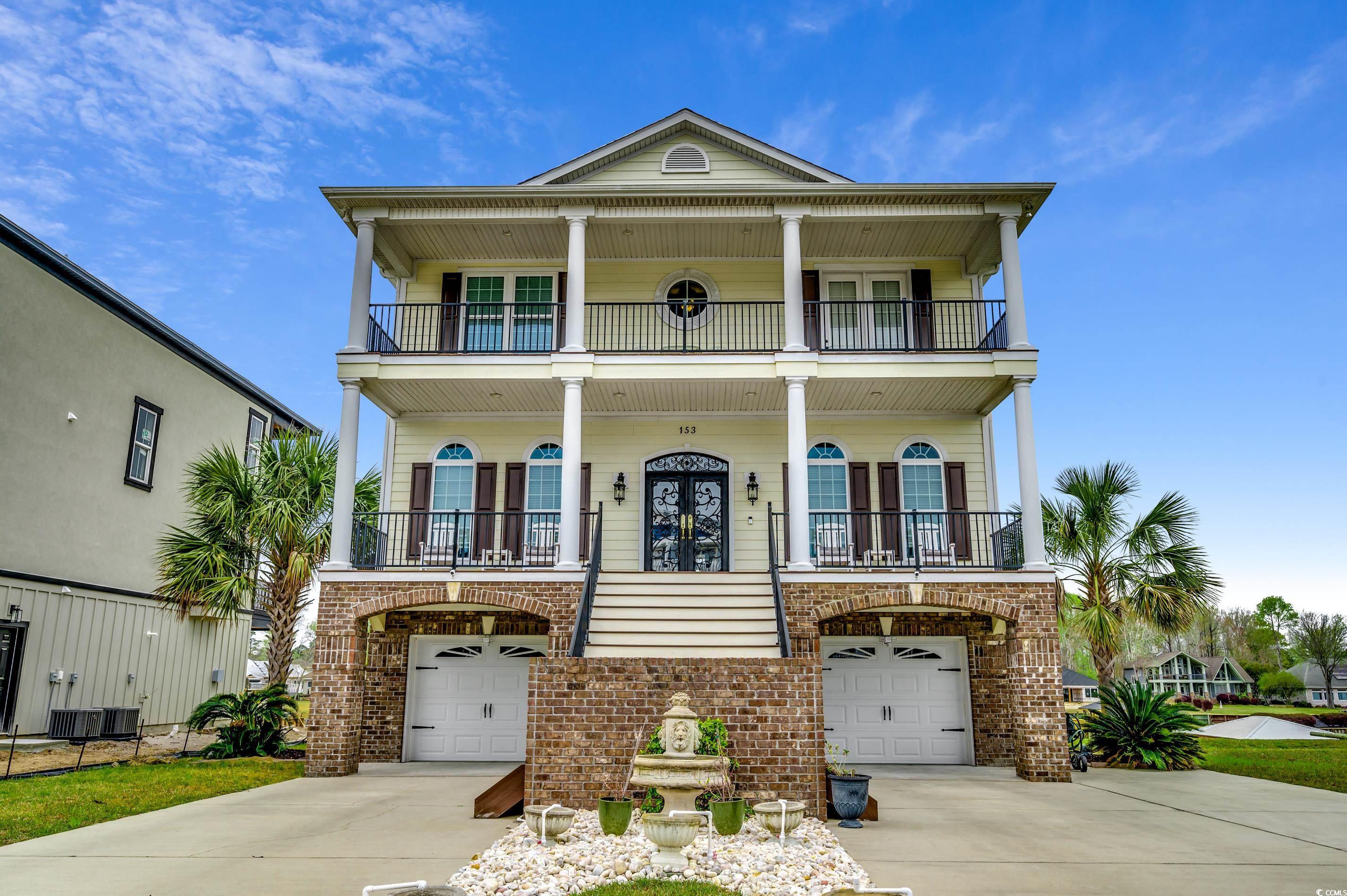 are you in pursuit of the ultimate intracoastal waterfront haven within a golf cart's reach from the beach? your search ends here! prepare to be captivated by this remarkable, energy-efficient custom-built masterpiece spanning an impressive 6,500 sq ft under roof. constructed with meticulous care using 2"x 6" materials, hurricane-resistant windows (rated up to 150 mph), and a roof boasting a lifetime warranty, this home is a testament to enduring quality.  elegance and functionality unite: the primary bedroom is a sanctuary of style and comfort, featuring his and hers walk-in closets, a tasteful tray ceiling, and enchanting waterway views. the expansive primary bathroom showcases a luxurious walk-in shower, inviting garden tub, dual vanities, and a dedicated make-up vanity for added convenience.  versatility and grandeur: beyond its grandeur, the home's first level boasts an inlaw suite, complete with a full bedroom, bathroom, kitchen, and a serene porch overlooking the intracoastal waterway. elevator access and washer/dryer hookups enhance the functionality of this level.  craftsmanship and detail: craftsmanship and attention to detail are celebrated throughout the home, with impeccable woodwork including crown molding, wainscoting, and chair-rail, setting a standard of sophistication. noteworthy upgrades encompass fireplaces, granite counters, stainless steel appliances, soft close cabinets, cherry hardwood, and tile floors.  unveiling distinctive features: additional captivating attributes include coffered & barrel roll ceilings, crystal chandeliers, a butler's pantry with a wine fridge, a recirculating water heater, and encapsulated air handlers ensuring optimal indoor air quality. front and back porches frame breathtaking waterway views, granting you front-row seats to stunning sunsets.  elevated design and practicality: the exterior marries form and function, showcasing a charming brick veneer on the lower front level complemented by arched garage doors. ample storage space awaits in the attic with a pull-down staircase.  exclusive waterfront community: located in the prestigious palmetto harbor, a fenced intracoastal waterway community, this residence offers access to an icw sitting & viewing area, two fishing ponds, and attractively low hoa dues. nearby parks and recreational areas add to the allure.  experience elegance: prepare to be enchanted by a home that embodies elegance, luxury, and artistry. schedule your tour today and immerse yourself in the allure of waterfront living at its finest.