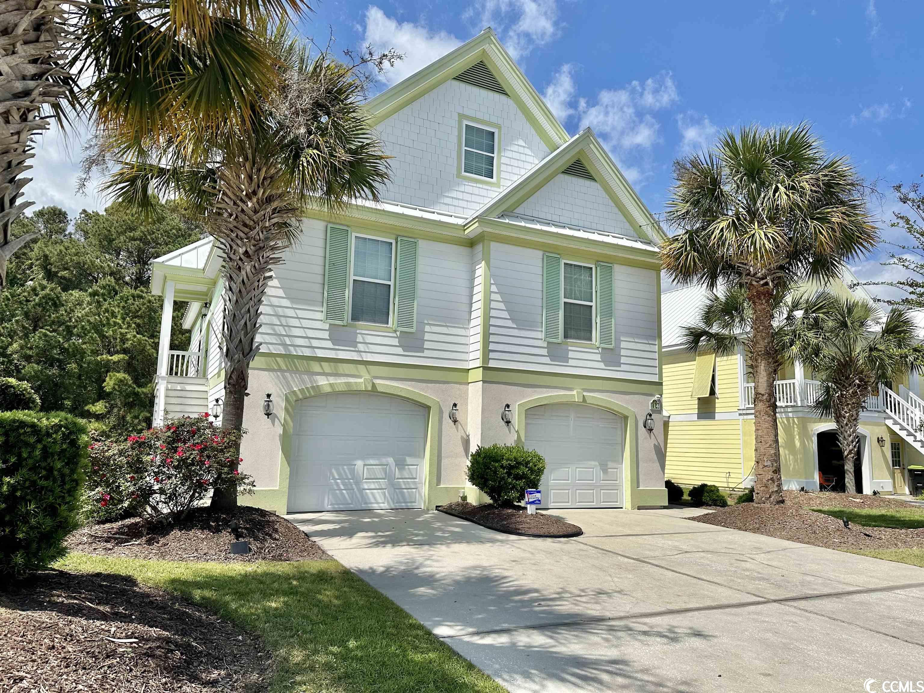 this beautiful home is located on the canal in the bermuda bay section of oceanside village. this unique st. george floor plan encorporates 4 large bedrooms, 3 full baths and 2 half baths, vaulted and tray ceilings with accent lighting, crown molding, granite counters in both kitchens, double oven on main level, with walk in pantry, newer trex decking, carpet, hvac's , and much more the main living quaters features an open floor plan with an endless amount of space and functionality.  its the perfect space for gathering with family and friends  there is one huge master suite with two walk in closets and a private en suite on the main level. on the 3rd level you will find another spacious bedroom and full bath.   the downstairs of this home can be used as a completely separate two bedroom unit that includesi ts own kitchen, living room, dining area, laundry room as well as one full and one half bath and a screened in porch overlooking the canal. its perfect for everyday living, visits from family and friends, or as a rental unit for extra income.  the garage is oversized with plenty of room for two cars, a golf cart and much more. home conveys furnished  you’ll feel right at home as soon as you walk in the door. amenities,including: 24 hour security, a private oceanfront parking lot, 2 outdoor pools, kids spalsh pad, an indoor pool, bark park, tennis,playground and more!    schedule your showing today and begin living the dream!