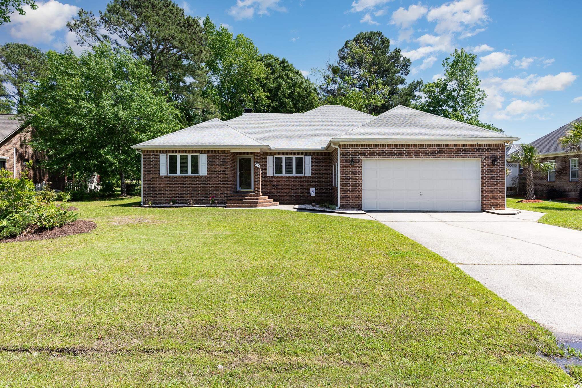 discover the remarkable gem of 521 saluda river rd in myrtle beach, sc. this immaculately kept 3br/2.5ba brick house offers a perfect balance of style and functionality, with a cozy wood-burning fireplace in the spacious living room. the large eat-in kitchen and den/office provide ample space for hosting, while the master suite offers a full bath, double vanity, and walk-in closet. the laundry room, half bath, and storage throughout the house add convenience. enjoy the freshly painted deck and carolina room overlooking the lake, with access for kayaking. the 2-car garage has storage and walk-up attic. come see this stunning property today!