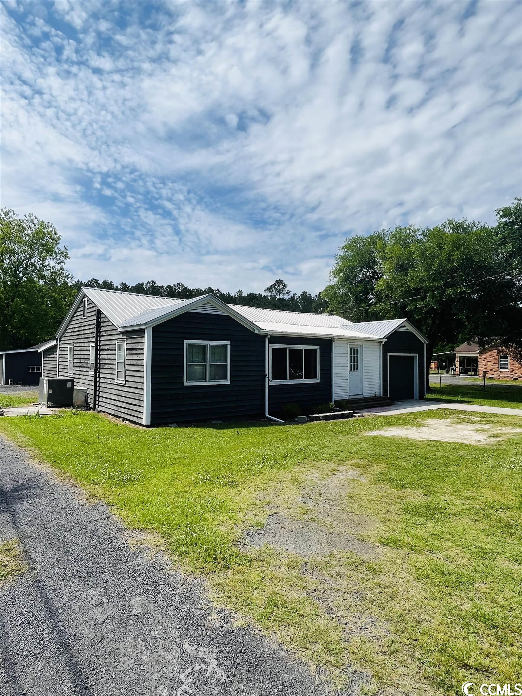 are you looking for a starter home with a large yard just over 2/3 of an acre, detached workshop with power and water, an additional "she shed" with power, and a neighborhood with no hoa? well, 4343 n fraser st. may be what you need! all one level, this 3 bedroom 1 full bath home, has a 4 year old metal roof and new hvac, and newly remodeled bathroom. this home sits on .69 acres, partially fenced in, and outside the city limits of georgetown. you are within 15 minutes to the beautiful beaches of pawleys island, and within 5 minutes of shopping, dining, grocery stores and schools. having a detached 2 workshop and an additional shed, this allows for ample storage.