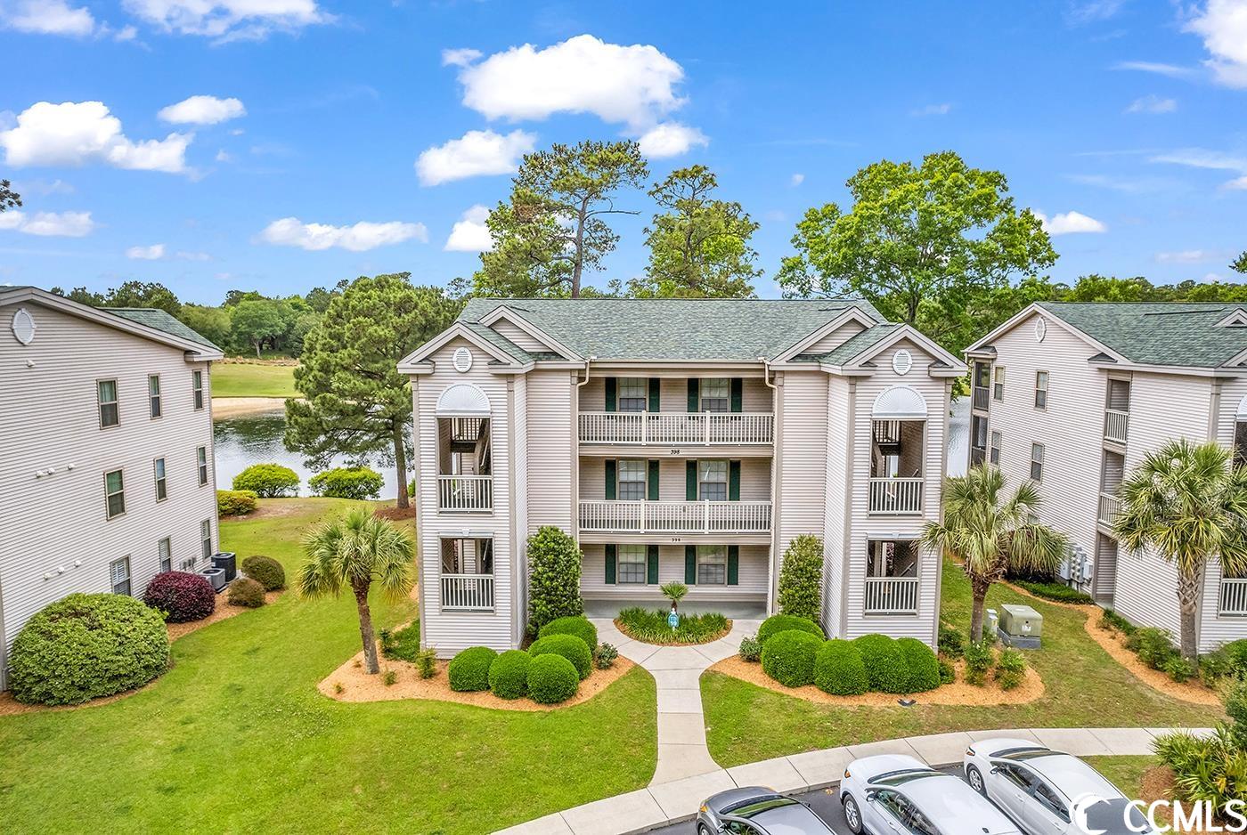golf and lake view condo in true blue! location is serene and quiet. true blue & caledonia golf courses are ranked in the top 100 public courses! don't miss this light and bright 2 bedroom, 2 bath, top floor condo. featuring vaulted ceilings and an amazing view of hole #4 of the golf course. relax on the screened balcony while watching the golfers before heading to the pool, conveniently located right across the parking lot. current owner has made some nice updates in the unit in last few months, including beautiful lvp flooring, new dishwasher, all rooms freshly painted, new sofa bed, new patio furniture, among others. it's just a quick drive to the beautiful beaches of pawleys island. pawleys island offers some of the best restaurants and shopping in the area. unit is being sold fully furnished. perfect as an investment condo, permanent residence, or your own 2nd home oasis.