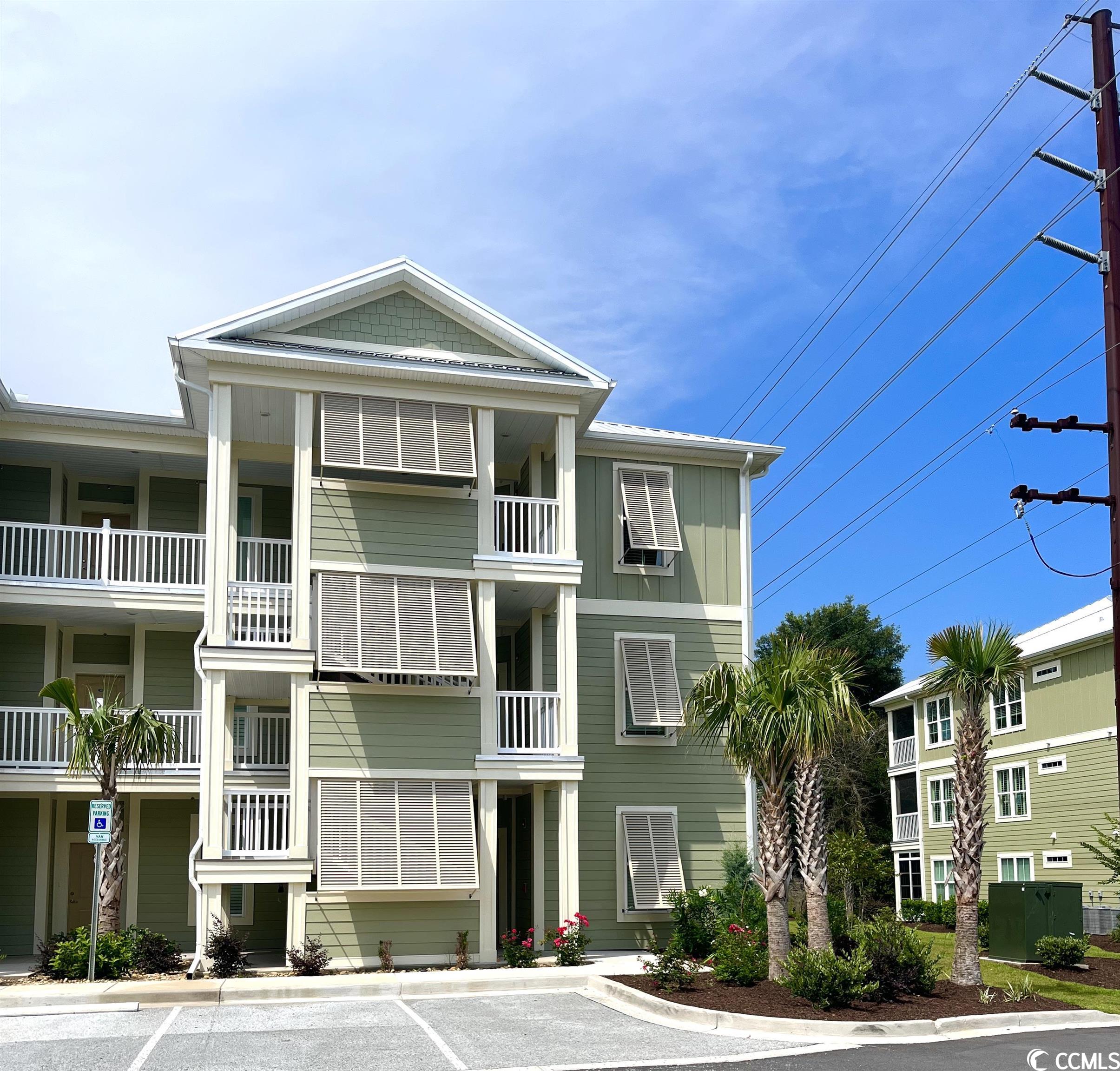 located in the heart of pawleys island, this end unit condo offers easy and convenient coastal lifestyle living. an affordable opportunity to have your own place at the beach. there is an extra "flex room" which may be used for an office, playroom or spare bedroom. elevators and a pool, hardwood floors, granite countertops, and a screened porch are a few of the details you'll love! while being located near public tennis courts, a fitness club, shopping and dining, you are also only a short drive to the beach, the river, golf courses, marches and marinas. this home offers all that you are hoping for in a sc beach community. unfurnished photos are of this unit. furnished photos are from a previously built model.