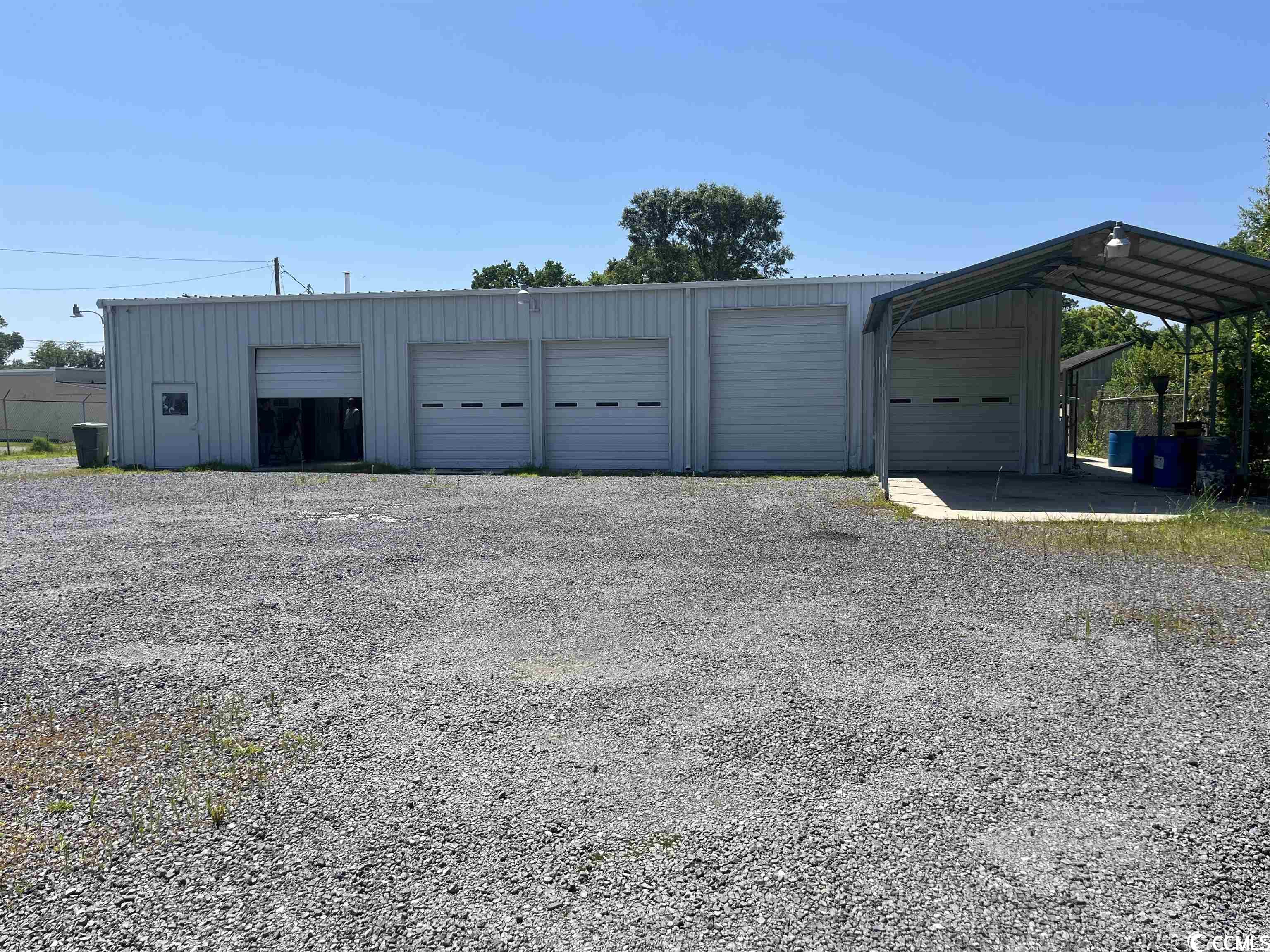 check out this perfect location for an auto body/mechanic garage. this 4,500 square foot garage is located in the city of georgetown with access from both merriman road and morgan street. it has 4 bays, 1 paint booth, ample storage space and both front and back parking lots completely fenced in. the office has its own sitting area for customers and two bathrooms. upstairs contains a small apartment with one full bathroom. come check out this space!