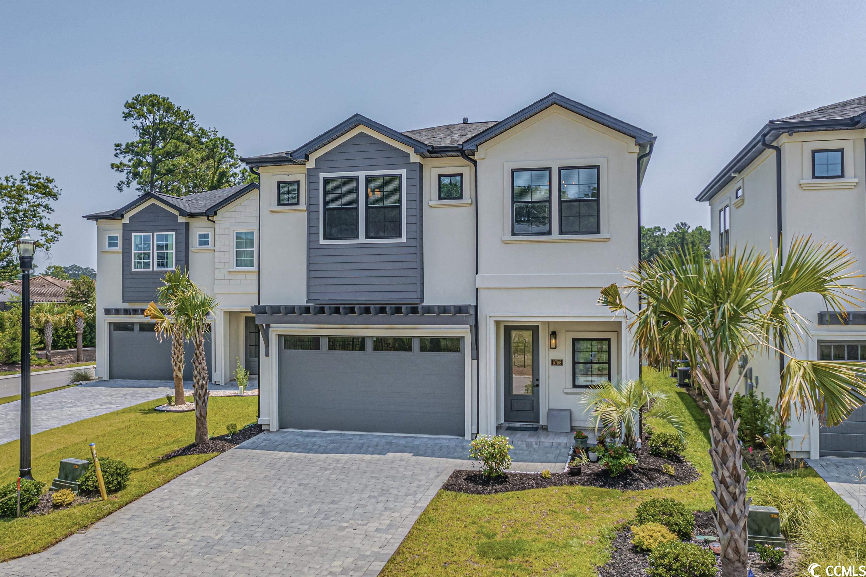 experience coastal living at its finest in this stunning, newly 2021 built, 4-bedroom, 2.5-bath home located in the luxurious gated community of ocean villas at 67th. situated east of highway 17, only .6 miles from the atlantic ocean, this former model home promises the perfect combination of luxury and convenience. the open concept design beautifully features a designer herringbone tile entry foyer, hardwood floors throughout, and spectacular exposed beam ceilings in the living room and master suite. the chef’s kitchen is equipped with top-of-the-line ge café appliances. all bedrooms are fitted with custom walk-in closets, and the house is wired with surround sound speakers both inside and out for your entertainment. the property sits on a waterfront lot, and comes with an outdoor kitchen featuring a lyon grill, perfect for alfresco dining. 6768 ocean breeze loop is more than just a home, it's a lifestyle. enjoy the beach life with your family in this luxury boutique community with incredibly low hoa fees. don’t miss out on this extraordinary opportunity to make beach living your reality. call to schedule your showing today!