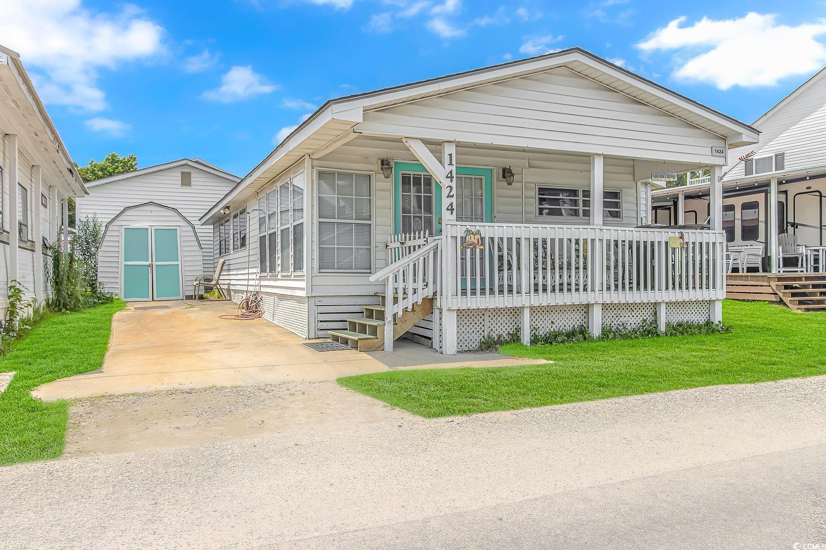 do you want to live on vacation full time or have a fabulous rental investment. this beach cottage is in the award winning ocean lakes, and is just a short stroll or golf cart ride to the beach, the private water park, camp store, snack bar, and all the other amenities that ocean lakes has to offer. this beach hide away features 4 bedrooms with 2 baths, a nice living room with kitchen, and a covered front porch for all your entertainment needs. make your dream of living at the beach come true!!!!!