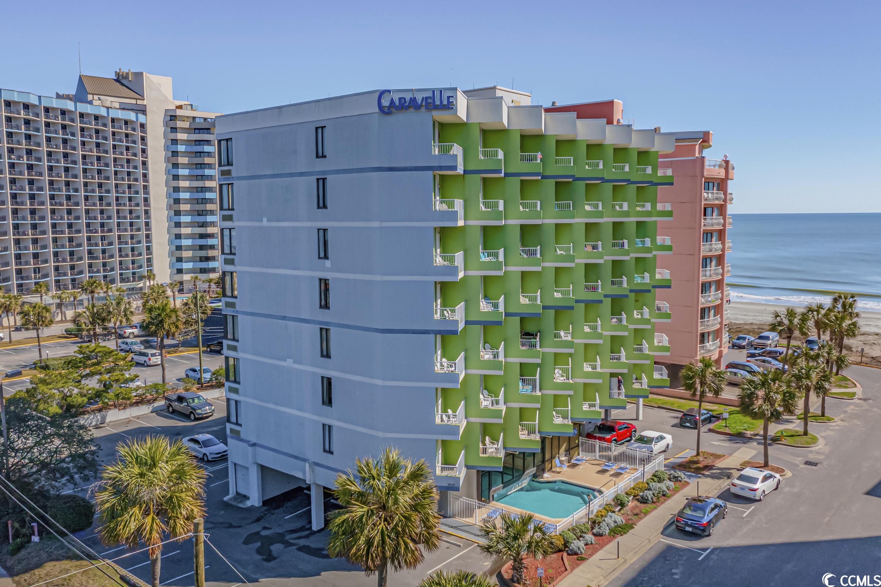 welcome to this ocean view end unit that has been completely redone... it is a true and spacious 1-bedroom and 1-bathroom condo.  this boutique building is quaint and small.  no front desk or crowded foyer.  laundry room located on first floor very nicely maintained.  new elevators... this condo is on the second floor so it is very easy to use the steps...  as you step inside, you'll immediately notice the modern and fresh ambiance that greets you. the entire unit has been thoughtfully updated throughout, boasting a contemporary style and attention to detail. a mirrored wall so when you are sitting in the living room you can see the beautiful ocean.  professionally decorated and all conveys at closing.    the open living space seamlessly combines the living room, dining area, and kitchen. the living area is thoughtfully furnished with new and inviting pieces, creating a warm and welcoming atmosphere. whether you're unwinding after a day at the beach or cozying up with a good book, the comfortable seating arrangement is perfect for relaxation. adjacent to the living area, there's a convenient workstation/desk area or additional dining space. just off the living room is the balcony. imagine waking up to a picturesque sunrise over the sparkling ocean while savoring a cup of coffee!  the kitchen is equipped with sleek stainless steel appliances that not only enhance the aesthetic appeal but also provide functionality and convenience for all your culinary endeavors. the dinette, located nearby, offers a cozy space for enjoying your meals.  the bedroom is tastefully decorated and provides a comfortable haven for rest and relaxation along with a peaceful sitting area. the furnishings are new, ensuring a pleasant atmosphere.   the bathroom has also been updated and features dual sinks and a tub/shower combo.  the caravelle tower at caravelle resort offers an indoor/outdoor pool (heated seasonally), onsite spa, and use of the amenities at the main resort building including the block-long poolscape with the large heated pool, whirlpool, lazy river, kiddie lazy river, and the wild water pool which features dump buckets and splashing fun! there is also an indoor pool and hot tub, sun deck, oceanfront lawn, beach access and more!  whether used for your vacation home or as an investment, this ocean view condo offers it all. immerse yourself in the beauty of the surrounding nature, enjoy the comforts of a well-appointed living space, and create unforgettable memories in this coastal haven. seller is a sc realtor.
