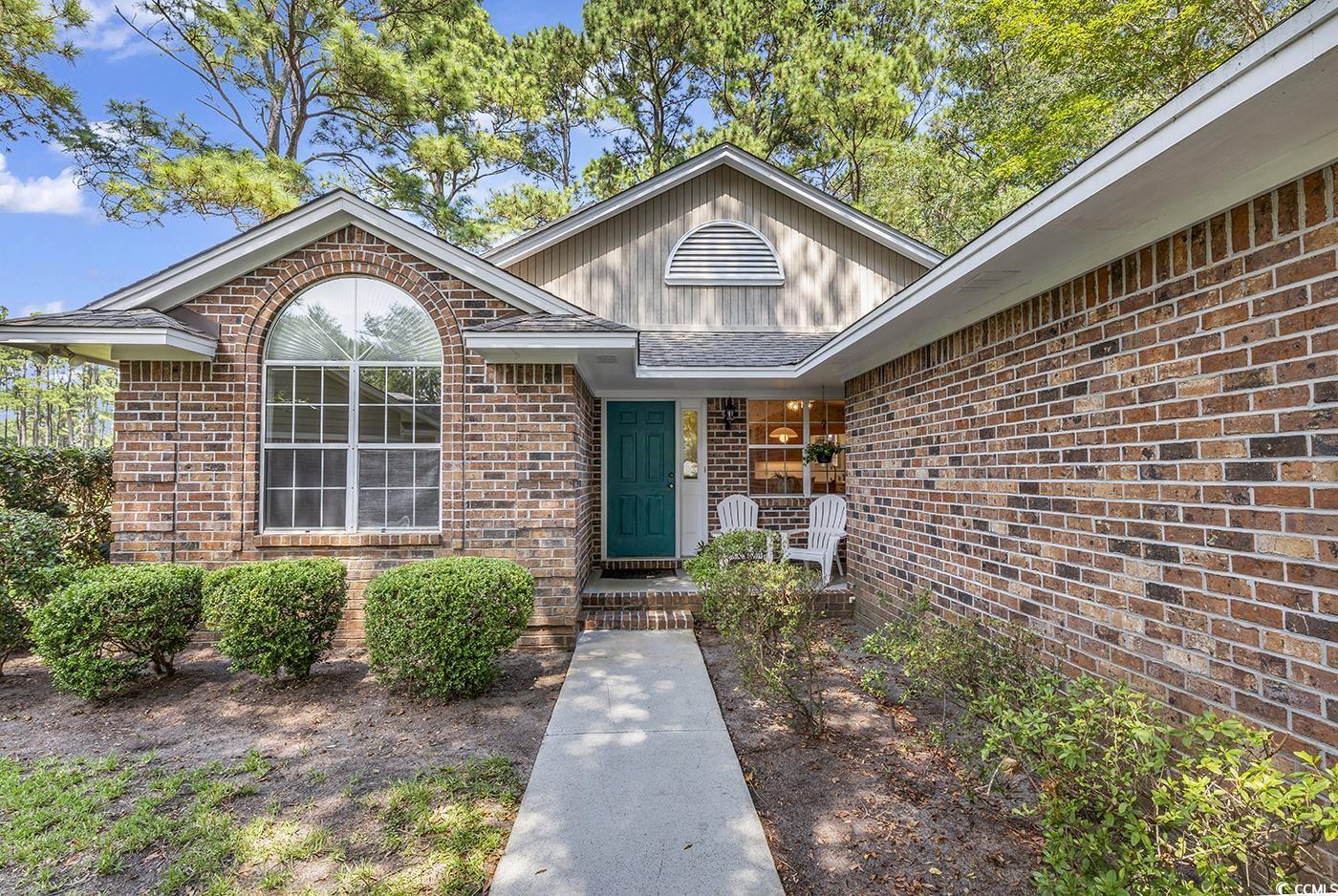if you are looking for a single-story home with 3 bedrooms and 2 bathrooms, on a cul-de-sac, with a view of the golf course, in a quaint, gated neighborhood, this is it! come see this home! they do not come on the market often in carrington point, in the river club. there is a beautiful pool, and golf course in the neighborhood, and access to the beautiful beach at litchfield by the sea. this home sits on the 13th fairway of river club golf course.  inside the home is gorgeous wood flooring, ceramic tile, and a decorative mirrored wall in the living room. the carolina room (great room) has many windows and a fireplace, and access to the back deck. the master bedroom sits in the back of the home, with the additional two guest bedrooms on the opposite side of the house. there are plenty of walking and biking trails.