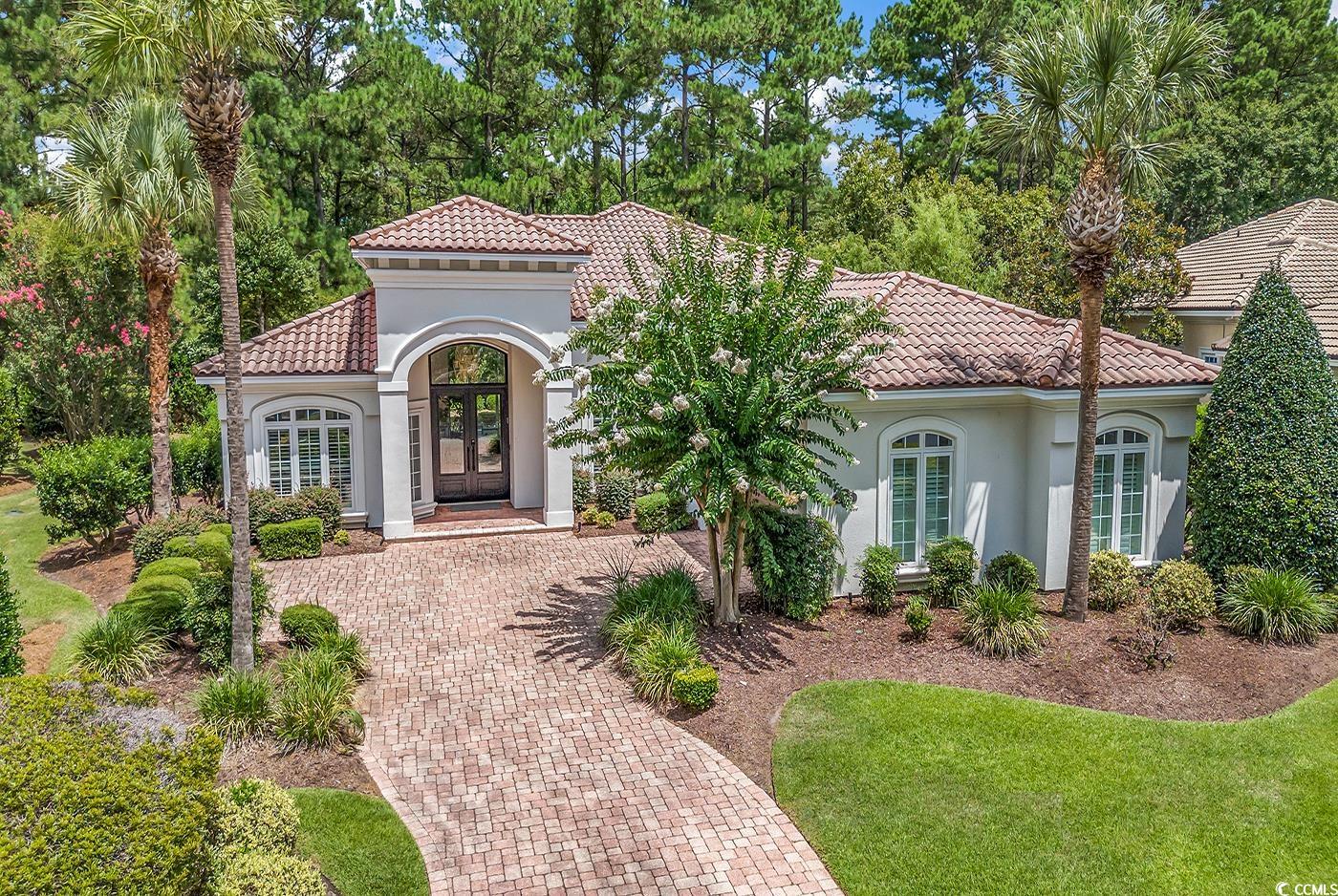 this is your opportunity to own one of the most state of the art homes in grande dunes- 8775 monaco circle. this exquisite and completely renovated steel-framed luxury residence is located in the prestigious capri village, over the bridge. if you’ve been searching, you know that homes this modern and meticulously done are nearly impossible to come by.   from the moment you step through the brand new steel front door, you'll be captivated by the attention to detail in this top-to-bottom renovation. the interior and exterior have been freshly painted and new tile flooring has been installed throughout. bask in the glow of the most luxurious light fixtures as you take in the beautifully lit backdrop of the natural wooded area surrounding the property.  the fully upgraded kitchen features top-of-the-line appliances, offering the perfect space to create culinary masterpieces. the home also includes a versatile office/gym/flex space and an epoxied and painted garage. unwind in the en-suite master bedroom, complete with a gorgeous bathroom that showcases a walk-in shower, soaking tub, spacious walk-in closet, and sliding doors leading to your tranquil backyard.   this exceptional home is ideally situated in south carolina’s premier coastal community in myrtle beach; grande dunes. stretching from the atlantic ocean to the carolina bays preserve, this 2,200 acre development is amenity-rich and filled with lifestyle opportunities unrivaled in this market and beyond. grande dunes owners enjoy a 25,000 square foot ocean club that boasts exquisite dining, an olympic size oceanfront pool with food & beverage service, along with meeting rooms and fun social activities. additionally, the community has two 18-hole golf courses along with several on-site restaurants, deep water marina, har-tru tennis facility and miles of biking/walking trails!  don't miss this unique opportunity to own the most turn-key home over the bridge. seize the chance to experience the epitome of modern elegance and style at 8775 monaco circle – your dream home awaits!