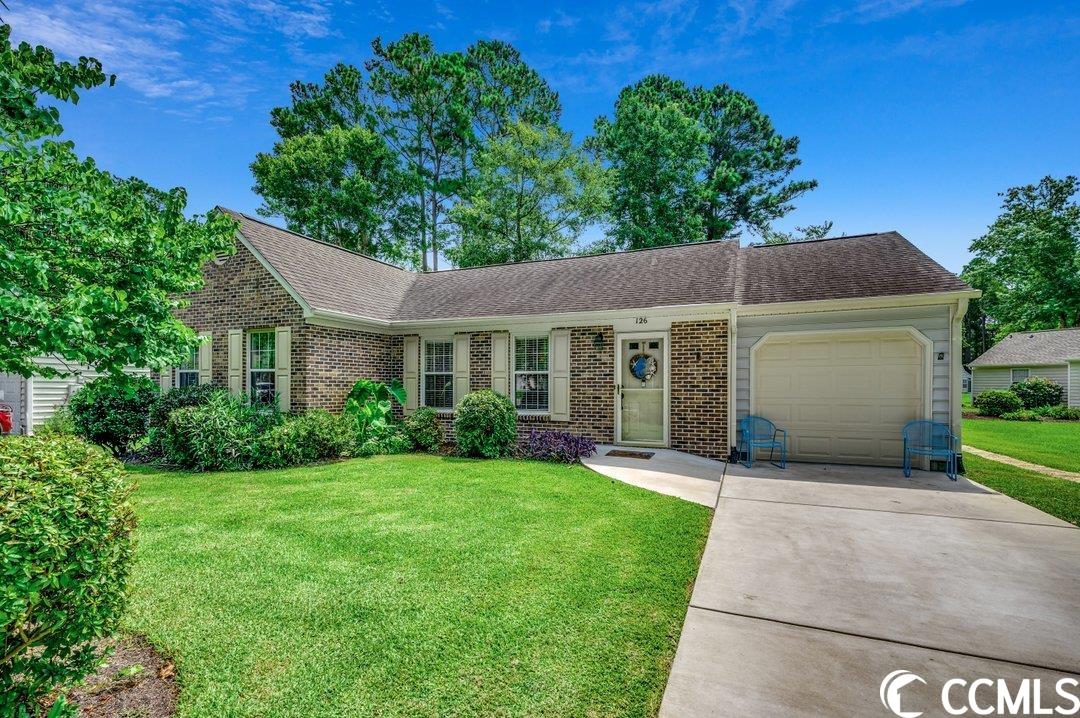 welcome to this delightful 2-bedroom, 2-bathroom ranch nestled in the serene woodlake village, a 55+ community located in the picturesque murrells inlet. step inside and be embraced by the allure of the spacious great room, adorned with vaulted ceilings that amplify the feeling of openness. a convenient coat closet stands ready to greet you. the great room seamlessly flows into the dining area, offering a glimpse into the well-appointed kitchen. the kitchen with a breakfast bar, a suite of included appliances, custom-painted cabinets, and a window framing a serene backyard view. the laminate floors throughout ensure effortless maintenance and a timeless aesthetic. your retreat awaits in the master bedroom, boasting a custom barndoor fashioned from repurposed charleston "rainbow row" shutters leading to the walk-in closet and en-suite bath which has been tastefully updated, featuring shiplap walls, a vessel sink atop a butcher-block countertop, new light fixture, exhaust fan, and a dedicated makeup counter. a generously sized guest bedroom and an accompanying guest bath, complete with a walk-in shower, provide comfort and convenience for your visitors. experience the serenity of nature in the carolina room, where sliding doors were replaced in 2022. venture outdoors to the newer concrete patio, where a custom firepit and grill await, creating the perfect setting for outdoor gatherings. this home boasts several noteworthy improvements, including the replacement of all ductwork in the attic in 2020, as well as new light fixtures adorning various rooms. the laundry room, equipped with a sink and cabinets, adds a touch of practicality to daily living. outside, a newer concrete driveway and walkway to the front door, thoughtfully designed for handicap accessibility, exude curb appeal, while gutters with gutter guards offer both functionality and aesthetics. residents of this remarkable community enjoy access to a well-appointed clubhouse, refreshing pool, and pickleball courts. embrace the comfort, convenience, and elegance this home offers, and seize the opportunity to become a part of the woodlake village lifestyle. your new chapter awaits!