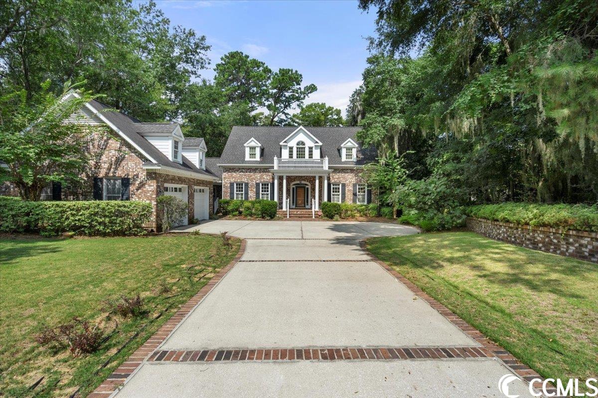 on the intracoastal waterway, with its own dock and within walking distance of a boat ramp -- come check out this beautiful, custom-built, colonial brick home in hagley estates, with no hoa. located minutes from shopping and countless amenities and only a short boat ride to downtown georgetown, where you'll find inviting riverfront restaurants, and just fifteen miles from the ocean via winyah bay. the home offers three spacious bedrooms, each with a private bath. the main-level master suite has an attached carolina room. the living room is an open floor plan with a double-sided wood-burning brick fireplace, perfect for entertaining or relaxing by a cozy fire overlooking tall cypress trees and the waccamaw river. the kitchen has plenty of cabinetry, as well as a center island and pantry. the dining area adjacent to the kitchen also has views of the icw. a large screened porch is accessed via sliding glass doors from the dining area or living room. the two-car semi-detached garage, accessed via a covered walkway from the laundry room entrance, has a large attic for storage, or could be converted into living space. the property's landscaping is served by an irrigation system. the west-facing back of the home offers stunning over-water sunset views. don't miss this rare opportunity to have your very own piece of paradise.