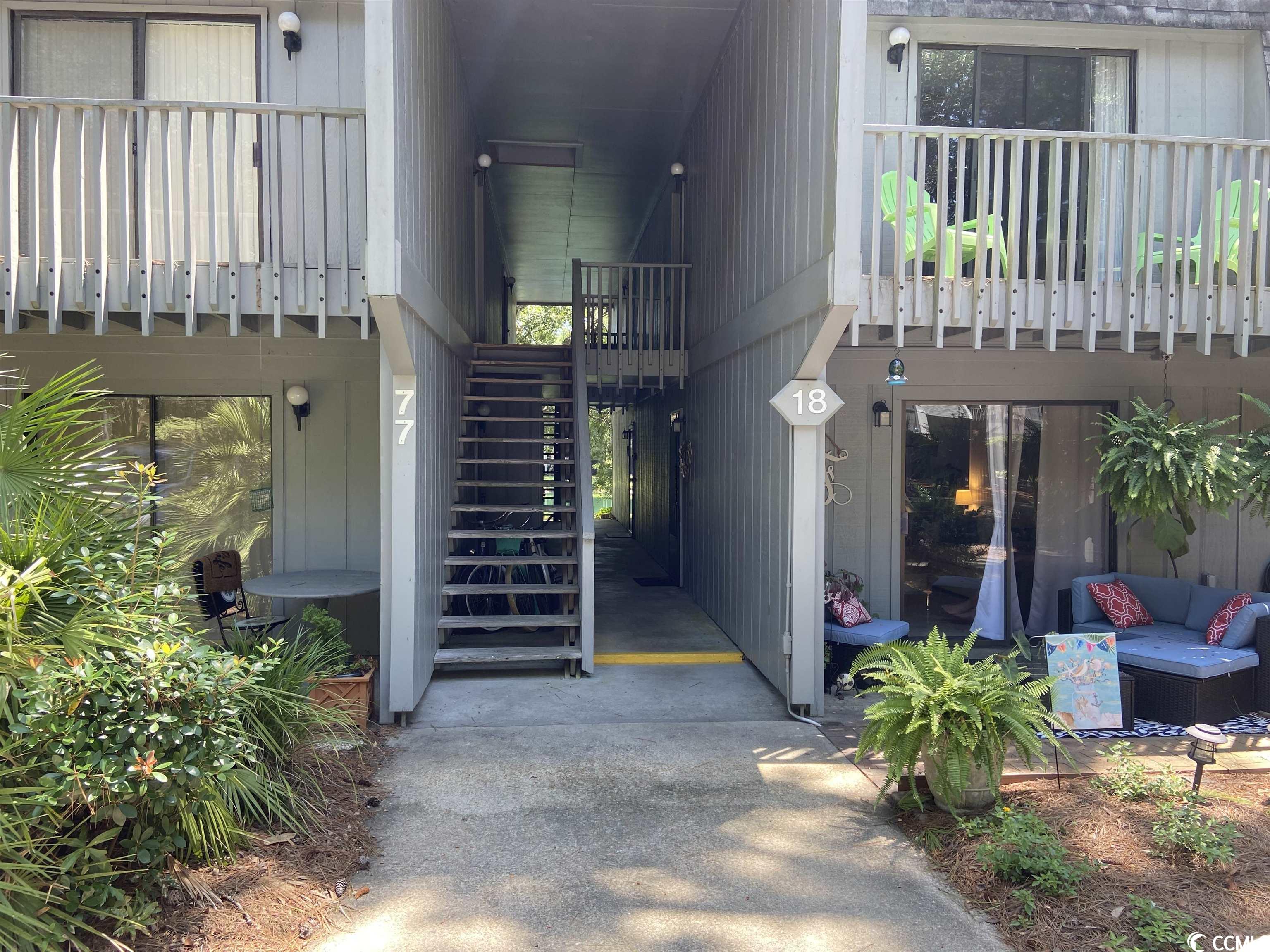 perfect getaway or permanent home! live the lowcountry lifestyle beneath magnificent live oaks within a creek front community located right around the corner from the beach. beautiful first floor, 2 bedroom, 1.5 bath condo boasts single-level living with patio as well as numerous improvements. homeowner made significant replacements and upgrades in 2021, including new water heater, kitchen appliances, flooring, granite bathroom counters, toilets, washer/dryer and much more. attached outdoor storage space. two-story low-rise complex has shared parking. hoa dues covers cable and wi-fi as well as water and sewer. community offers creek dock, owner clubhouse, swimming pool, small-boat storage area and temporary boat parking. convenient to golf courses, shops and restaurants. walk, bike or drive to litchfield beach. excellent long term rental opportunity.