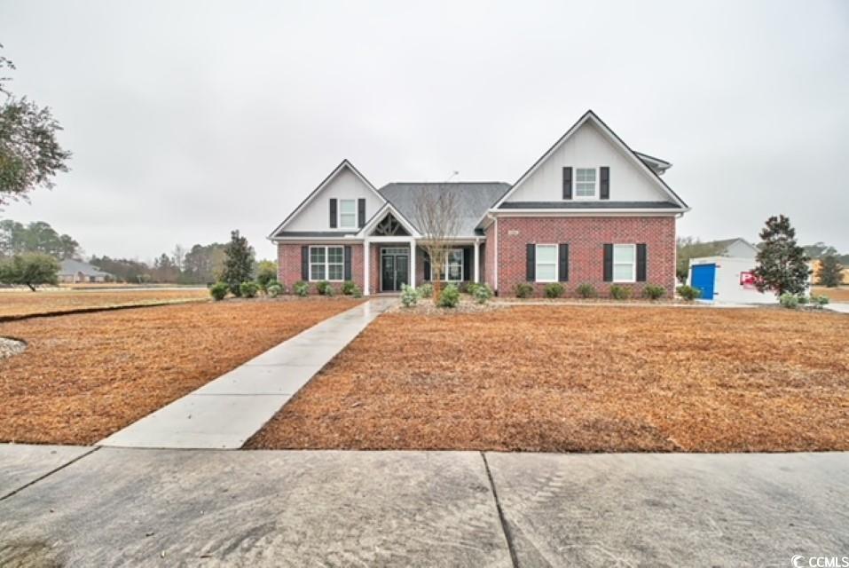 this stunning all-brick home is located on a corner lot in the highly desirable wild wing plantation subdivision. the home was built in 2021 offering a unique floorplan with tons of upgrades. coffered ceilings in the main living space for a grand presentation are accented by lvp flooring throughout. granite countertops, gray 42-inch cabinets, stainless steel appliances, and a tile backsplash in the kitchen. the master suite offers a tray ceiling, a large walk-in closet, double vanity sinks, and a massive glass shower with floor-to-ceiling tile. you will also notice this home has an additional large bedroom that could be utilized as a second master bedroom or den/office space. as you walk through the home you will see the attention to detail with upgraded trim such as 7-1/2 inch baseboards, crown molding, and wainscoting throughout. tasteful selections accentuate the space including an oversized laundry room, large tile showers in all the bathrooms, and built-ins for additional space savers. to compliment the stunning interior of the home the exterior is equally as impressive showcasing the large screened-in back porch with decorative stamped concrete, extended walkways, and a three-car sideload garage. located within minutes of the beach, as well as all the shopping, dining, and entertainment that the grand strand has to offer. schedule your showing today !!!