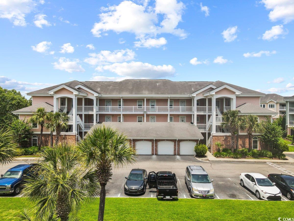 seller is offering closing credits!  welcome to this stunning, fully furnished first floor unit at magnolia north in myrtlewood that comes with it's own private garage. as you enter the unit, you will find that the open concept living area seamlessly blends with the dining space, providing a versatile and spacious layout for entertaining family and friends. upgraded tile flooring throughout the unit adds to the seamless transition of rooms.  the well-appointed kitchen is complete with appliances, custom cabinetry, ample storage space, and a breakfast bar.  the master bedroom offers a peaceful retreat with its own ensuite bathroom, complete with an upgraded tile shower, providing convenience and privacy. the second and third bedrooms are equally charming, allowing flexibility for guests or additional family members. the screened in porch overlooks the pool and has added storage space.  as an added benefit, this condo allows owners to capitalize on the thriving vacation rental market, as short-term rentals are permitted. easy access to myrtlewood's 36-hole golf course and driving range and a short drive to broadway at the beach, restaurants, shopping, and the atlantic ocean.