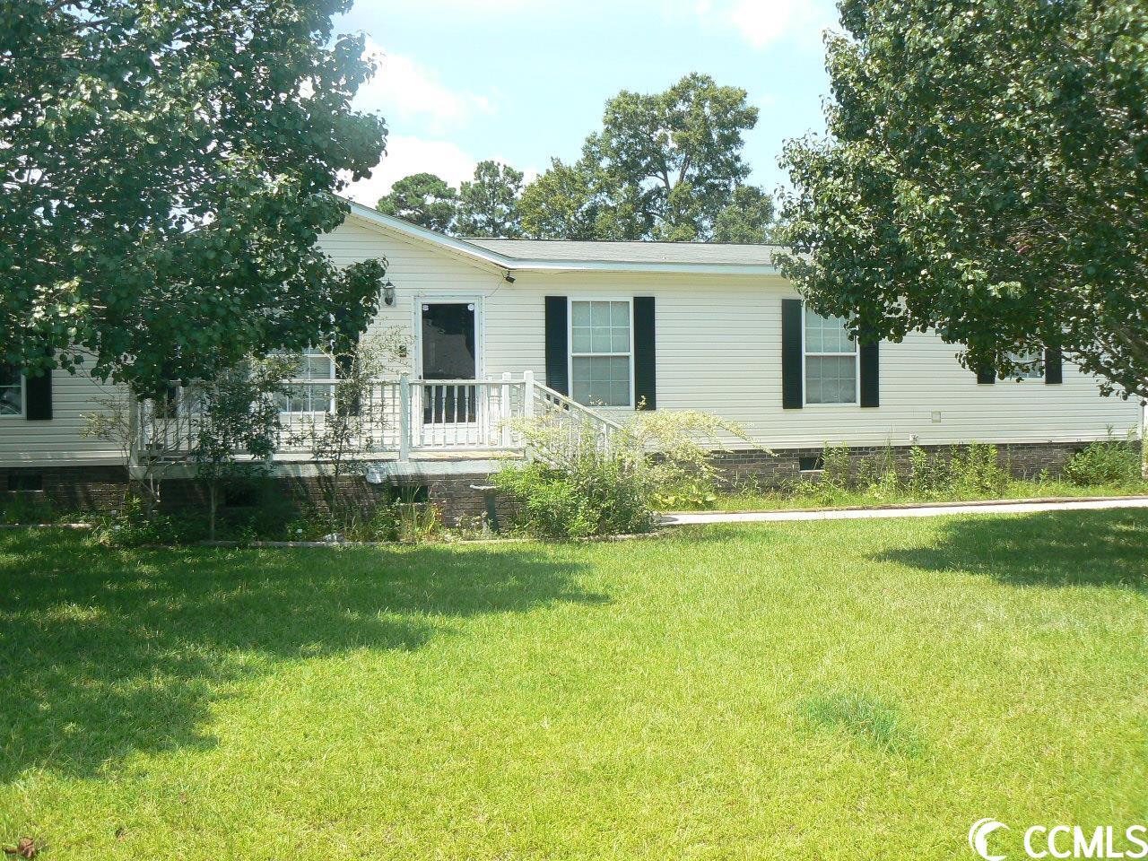 tired of hoas and living in the city limits? great opportunity to buy a home with lots of potential and give it your personal touch! this bricked-under home is situated on .25 acres on a fresh water pond and no hoa! with over 1900 heated square feet, 3 large bedrooms, his and her closets in the master bedroom, functioning wood burning fireplace, spacious kitchen, and mature trees, this home is ready for you! located within 15 minutes of the north myrtle beach and little river waterfront and a short ride to all that the grand strand has to offer. call today for a showing!