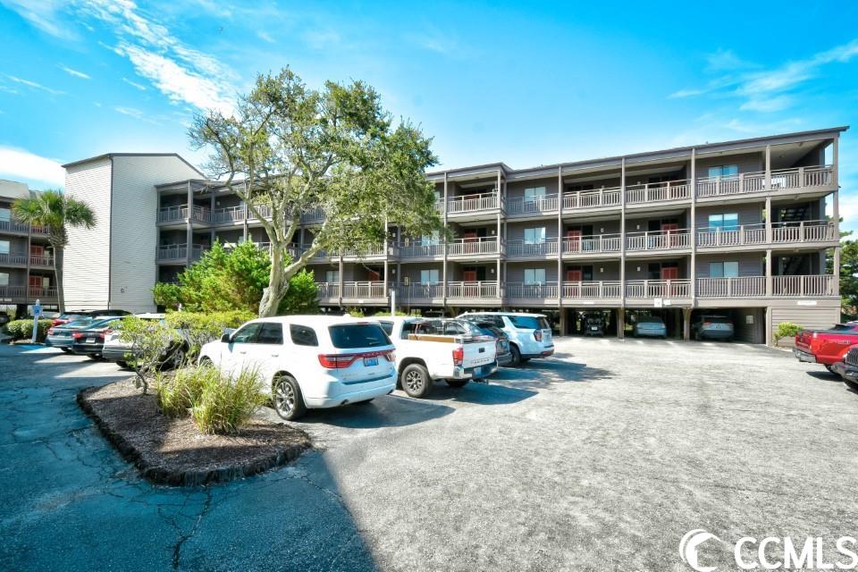welcome home to this fully furnished, 3 bedroom, 2.5 bathroom condo with an ocean view in tilghman beach & racquet club. this unit is truly move in ready! featuring a spacious open floor plan of the main living areas with updated tile flooring, crown molding, new hvac in 2021, and well coordinated furnishings in every room. the kitchen is equipped with all stainless steel appliances, updated countertops with a backsplash, and a breakfast bar leading into the living and dining areas. a wet bar in the hall adds ease and convenience for entertaining and spending time with the whole family. each bedroom features plenty of closet space and easy access to a bathroom, while the master includes these features, along with a private master bath with upgraded tile, granite vanity, shelving for extra storage, and a sliding glass door to the balcony! a washer and dryer is included with sale for added convenience. enjoy the view of the ocean and the pool from your 2nd floor balcony, and spend your days at the community's amenities or the beach just a few steps from your door. tilghman beach & racquet club offers a community pool, hot tub, tennis & pickle ball courts, a grilling area, and is perfectly situated near all of the grand strand's finest dining, shopping, golf, and entertainment attractions, with just a few steps to the ocean! whether you are looking for an investment opportunity, 2nd home at the beach, or your forever home, you won't want to miss this. schedule your showing today!