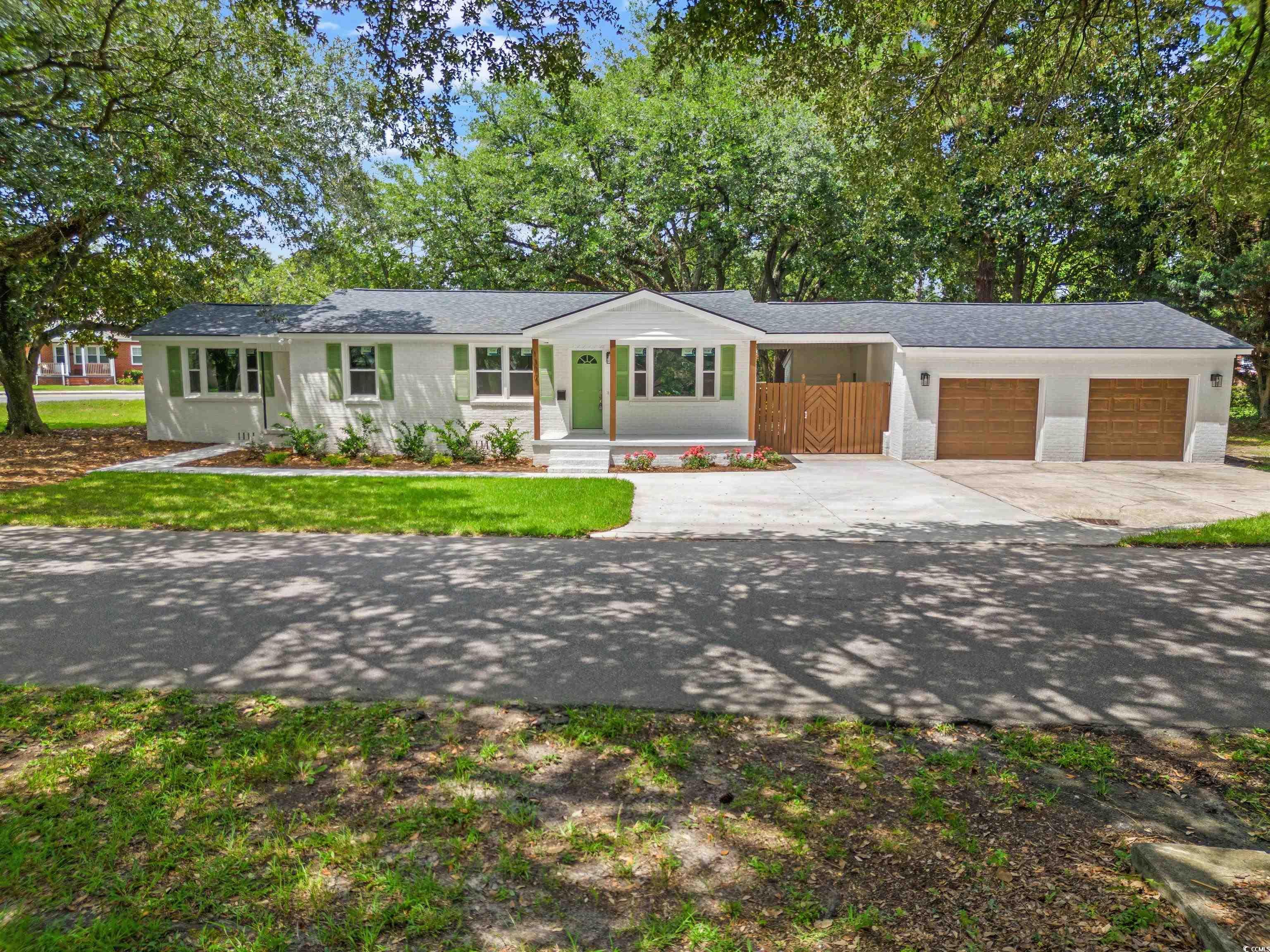 back on the market, due to no fault of the seller    seller is offering a credit to the buyer at closing. reach out to the listing agent for more information.  welcome to your dream home in georgetown, south carolina; where the streets are lined with mature live oak trees! this stunning 4-bedroom, 2-bathroom home has been newly updated and offers two separate living quarters, filled with natural light and showcasing modern living in a tranquil georgetown setting. recent updates include, new roof, new hot water heater, all new vinyl double hung windows, newly poured driveway and sidewalk, two new garage door motors, and all new interior and exterior doors to just name a few. situated on a spacious 1-acre lot, this property offers ample space for outdoor activities and relaxation. take advantage of the breezeway access to your attached 2 car garage providing convenient parking, attic access, and additional storage options.   fall in love with the open-concept living area with a brand new kitchen, including stainless steel appliances. be sure to direct your attention to the full bathroom that offers a beautiful luxury tile.   as you make your way down the sidewalk you will then enter the second living quarters of the home. this space has many potential uses; as it has its own kitchen and full bathroom, with a separate entrance.     this home has been thoughtfully updated, with no detail overlooked during the renovation process. from the luxury vinyl plank flooring to the elegant light fixtures, every element has been chosen to create a harmonious and comfortable living environment.   this peaceful neighborhood in the heart of georgetown, offers a blend of serenity and accessibility. close proximity to schools, shopping and fitness centers, parks, as well as walking distance to tidelands georgetown memorial hospital. it is conveniently located only 1 mile from the public boat ramp, 15 minutes to the beaches on pawley's island, and about an hour from downtown charleston.   don't miss the opportunity to make this newly renovated gem your forever home. contact us today to schedule your private showing and experience the beauty and charm of this exceptional property in person. your new life in georgetown awaits!  *virtual staging used*