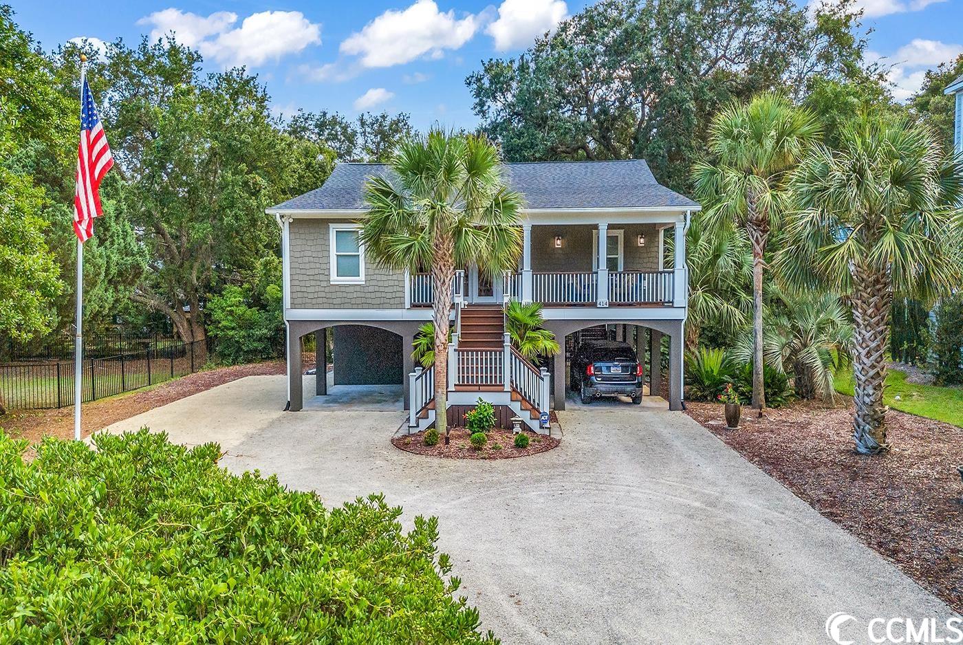 nestled amidst the serene beauty of this exceptional coastal property it offers a unique blend of relaxed living and upscale comfort.  boasting an ideal location within a picturesque neighborhood, this home presents an opportunity to experience the quintessential coastal lifestyle.  the exterior of the home exudes charm with its traditional architecture, welcoming front porch complete with all composite decking, and lush landscaping that captures the essence of lowcountry living.  step inside to discover an inviting living space that seamlessly integrates style and function. the layout allows for effortless flow between the living room, dining area, and kitchen, perfect for both family living and entertaining. next, you will find the luxurious owners suite. it is a sanctuary of comfort, complete with an abundant amount of storage with a total of three closets. the en-suite bathroom featuring dual sinks, a beautifully tiled shower--a perfect retreat after a day of enjoying the nearby beaches. relax in your saltwater soaking pool or lounge on your outdoor patio with natural surroundings. the well-maintained yard offers lots of accent lighting which makes the night scene come alive.  on the ground level home offers conditioned space with workshop/mancave, golf cart garage and a separate storage room. home is even equipped to accommodate an rv as it has 30 & 50 amp and water hook up. located just a short walk from the renowned beaches of litchfield/pawleys island, you can easily enjoy sun-soaked days by the ocean, beachcombing, and water activities. book your showing today!