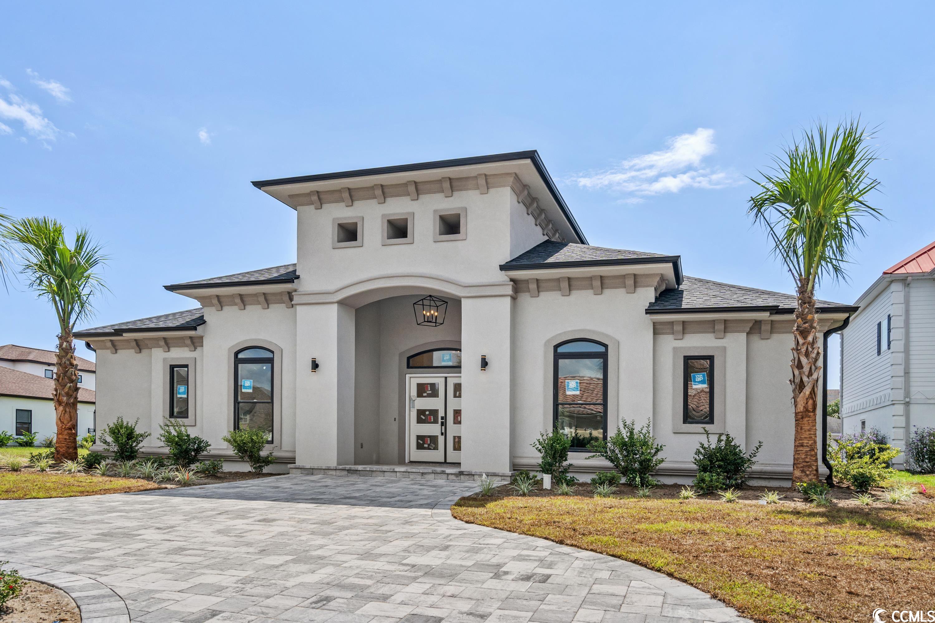 nestled in the esteemed community of the bluffs on the waterway, this mediterranean-inspired masterpiece awaits. boasting 4,368 total square feet, with 3,268 sq. ft. of conditioned space, this predominantly single-level home offers both luxury and function. flexible living spaces present up to 5 bedrooms, with a prime room suited for a home office and a separate upstairs bonus room featuring an ensuite bathroom. exquisite craftsmanship is evident throughout - from quartz countertops, wainscoting, extensive moldings, a coffered ceiling adorned with wood panels, to a captivating stacked stone fireplace and custom soft-close cabinetry.  the heart of the home – the kitchen – is a chef’s delight, equipped with ample custom cabinets, a grand island with barstool seating, a double oven, and a distinct custom range hood. the first-floor master suite promises sanctuary; imagine a 5-star hotel experience with a spacious walk-in shower, garden tub, and a cavernous closet.  outside, the expansive covered patio transforms into an entertainer’s dream, complete with a summer kitchen. additional exterior features include a circular driveway, rear-entry garage, and abundant parking on a street-to-alleyway lot.  located in the sought-after bluffs on the waterway, residents relish in amenities like pools, two clubhouses, private boat storage, tennis, a children's play area, and more. with its close proximity to white sandy beaches, shopping, world-class golf, and acclaimed restaurants, this home encapsulates the finest myrtle beach lifestyle. don't miss the opportunity to call this lavish estate your home!