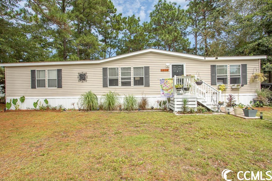 great location - 3 bed/ 2 bath manufactured home with land - no hoa !. easy access to conway, myrtle beach, surfside beach and surrounding beaches. just minutes from ccu , hgtc, conway hospital, downtown conway, riverwalk, grocery stores, shopping, restaurants and area beaches. this home has a split floor plan with spacious bedrooms, nice size closets providing you with lots of storage space. large screened porch off the back of home overlooking backyard, detached storage building, front deck porch, plenty of yard space, mature landscape, and fenced backyard. this split floor plan offers you a spacious sized great/family room area with vaulted ceiling and ceiling fan. eat in kitchen with plenty of cabinet storage and a formal dining room. large master bedroom suite with walk-in closet, master bath has walk-in shower, garden tub and double sink vanity. second bathroom has a tub/shower combination and vanity. separate laundry room, ceiling fans in all the bedrooms and eat in kitchen. give your realtor a call today to schedule a showing on this home! square footage is approximate and not guaranteed. buyer is responsible for verification.