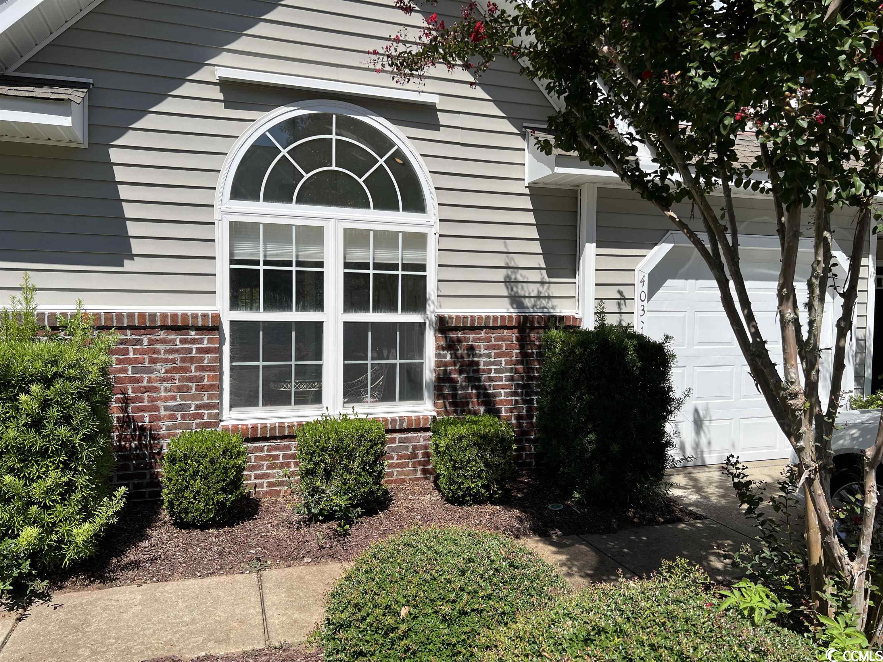 nestled within the picturesque coastal community of pawleys island, 403-1 red rose blvd presents a remarkable opportunity to embrace the lowcountry lifestyle. this charming 3 bedroom/2.5 bath townhome offers a perfect blend of comfort, convenience, and coastal charm. as you step inside, you will be greeted by an inviting open living space illuminated by natural light. the spacious living area seamlessly connects to a well-appointed kitchen. the 1st floor primary suite boasts its own en-suite bathroom, creating a private retreat. the 2 generously sized bedrooms on the second floor provide ample space for guests. step outside onto the screened porch and enjoy the tranquil lake views. rose run is a well-maintained community. whether you're seeking a primary residence, a vacation getaway, or an investment property, this condo offers a versatile and convenient living opportunity. the location is simply unbeatable, with easy access to the beautiful pawleys island beaches, championship golf courses, boutique shopping, and an array of dining options. don't miss this chance to own a piece of the sc coast!